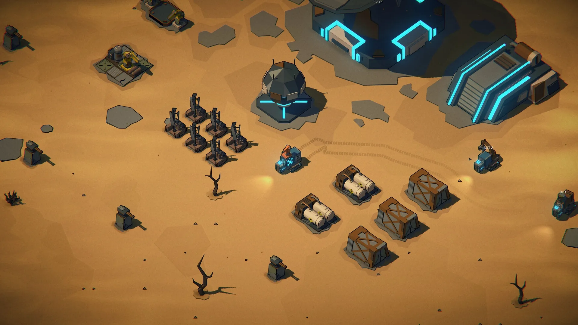 Machine Mind: Overhead view of base with bots, storage tanks, and futuristic buildings in desert terrain