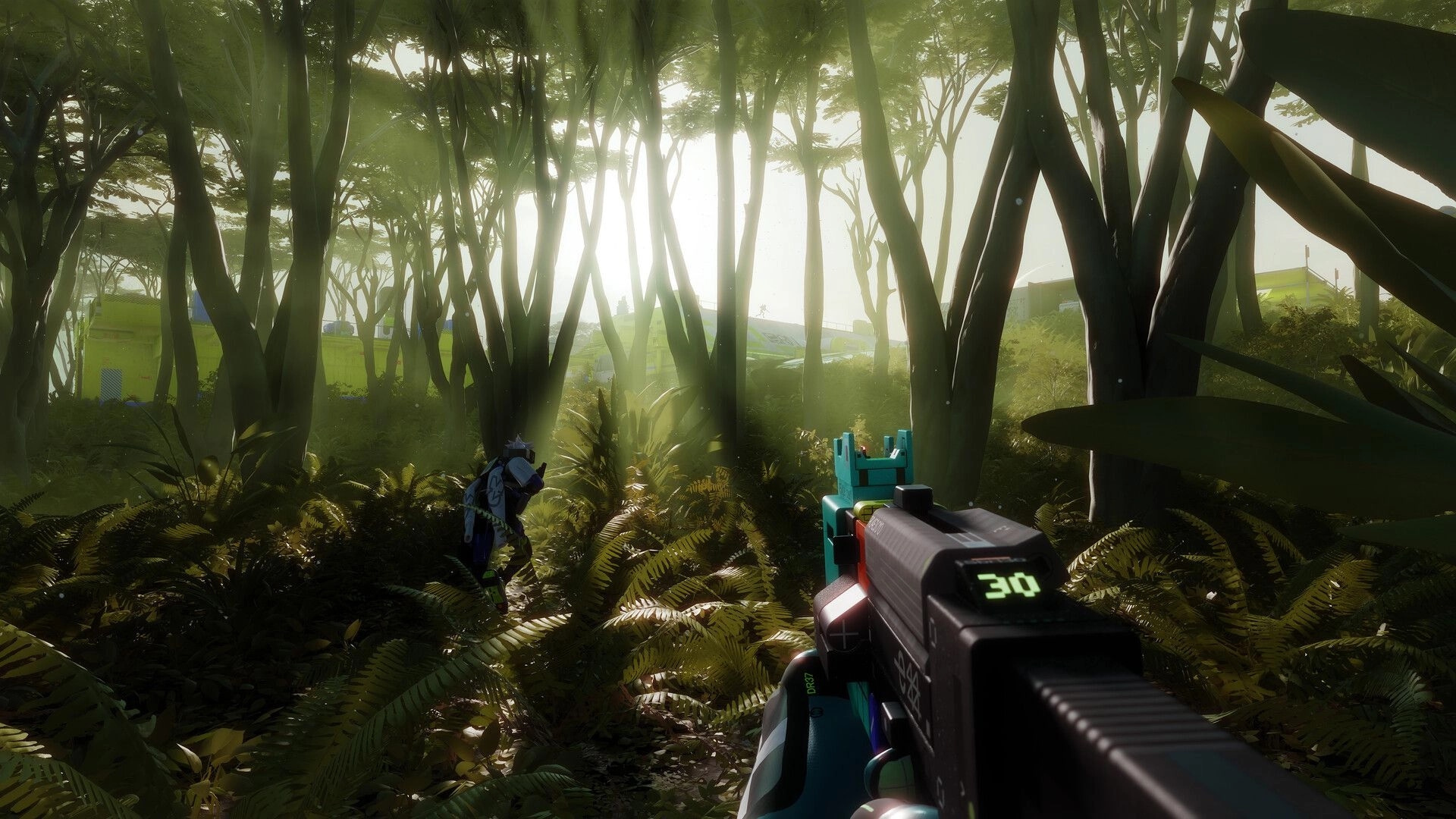 Marathon: First-person rifle aiming as a teammate crouches in dense forest near green buildings.
