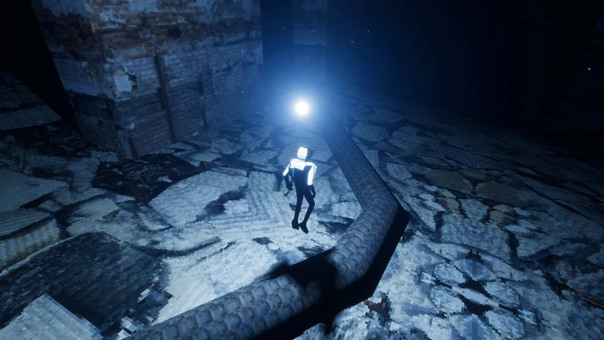 MEGANAUT: Player character floats near glowing orb on rocky terrain in dimly lit industrial environment.