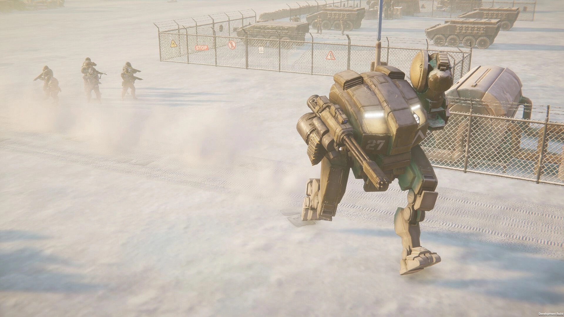 MENACE: Mech leads infantry through snowy military base with vehicles and perimeter fencing visible