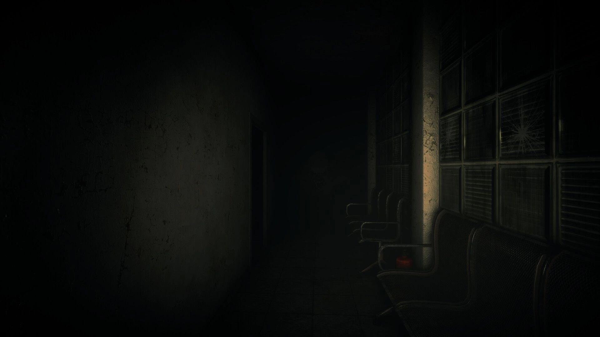Menthal: Exploring a dim hallway with cracked walls, bench seats, and broken window panes.