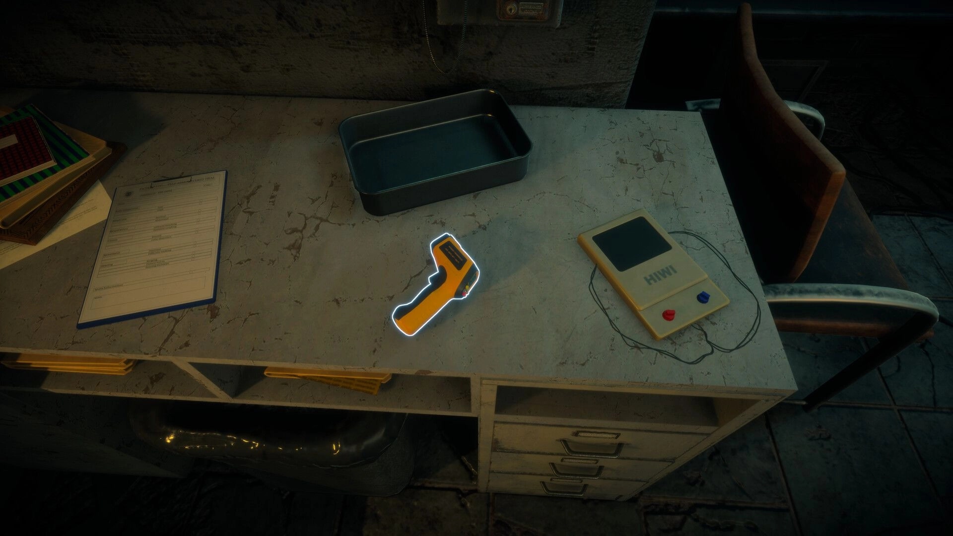 Menthal: Highlighted handheld scanner on a lab desk beside clipboard, tray, and wired device.