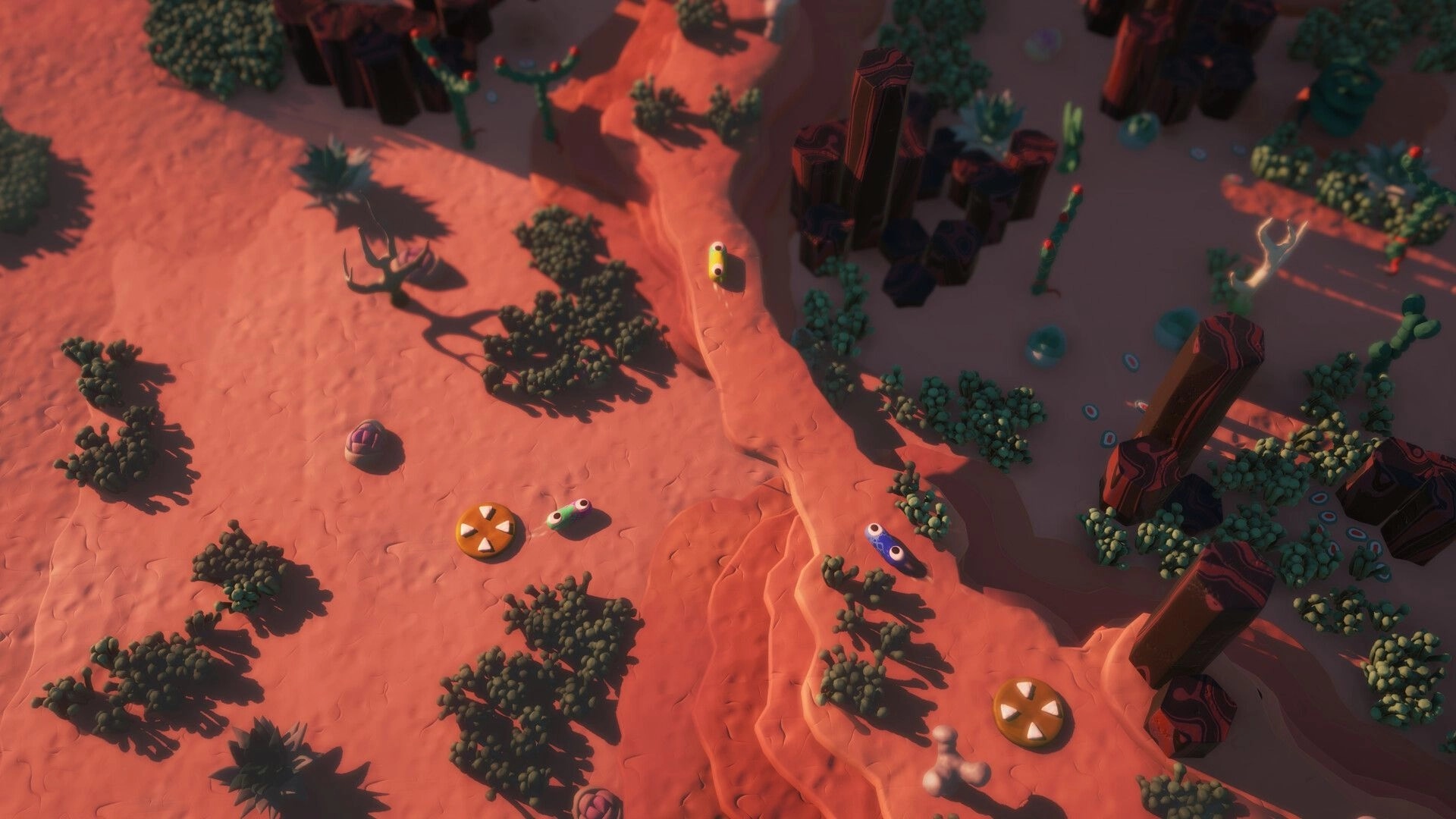 Mewts: Colorful characters racing in a desert arena with scattered obstacles and rocky terrain.