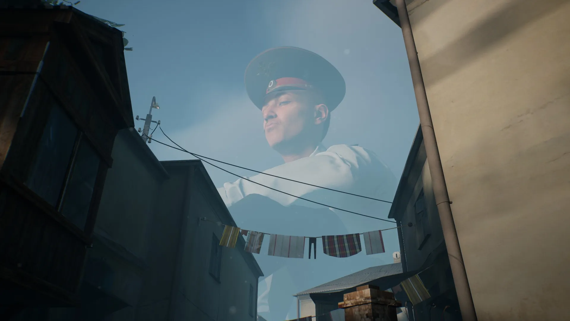 Militsioner: Colossal Policeman looms over narrow alley with clothesline under blue sky.