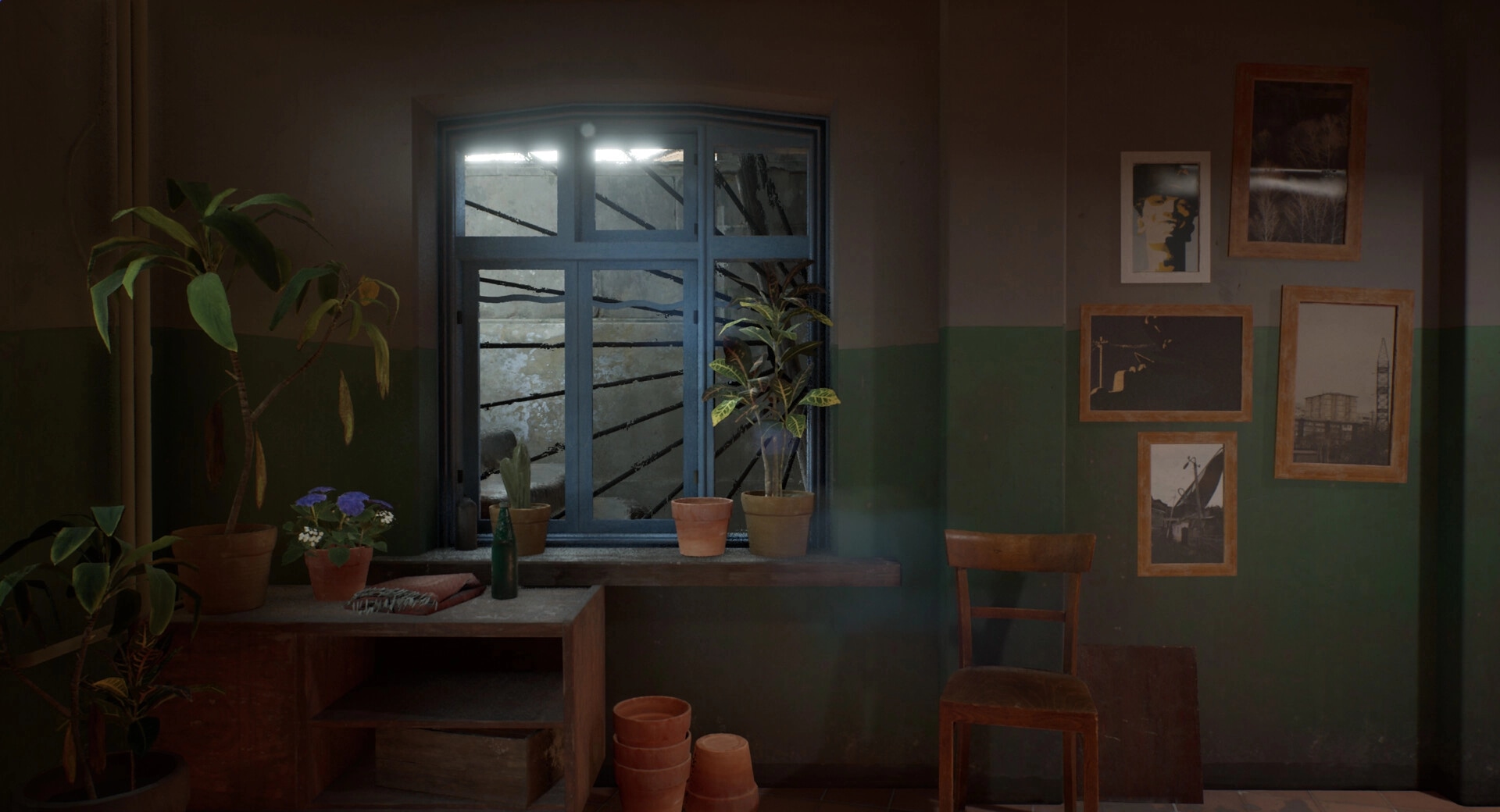 Militsioner: Interior room with plants on a windowsill, framed photos, and a wooden chair against a wall.