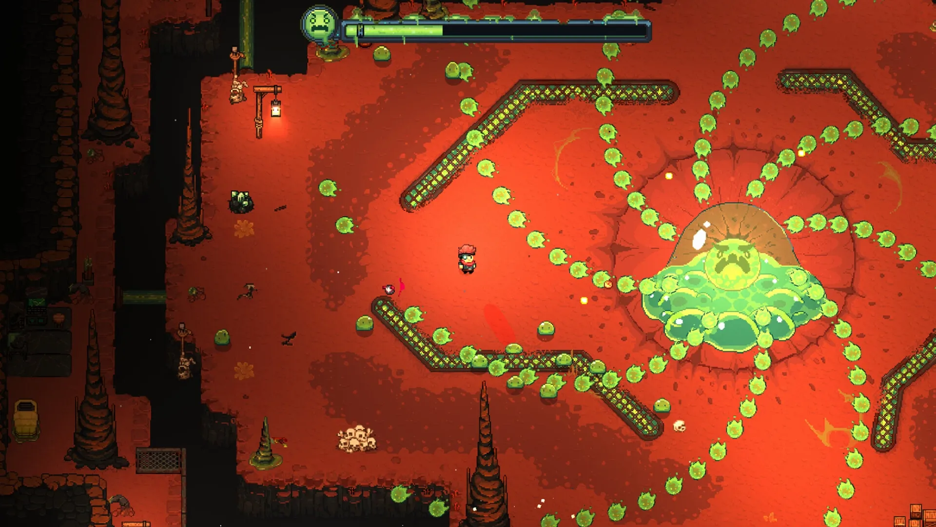MineGeon: Player faces giant green slime boss in a red cavern with glowing health bar above.