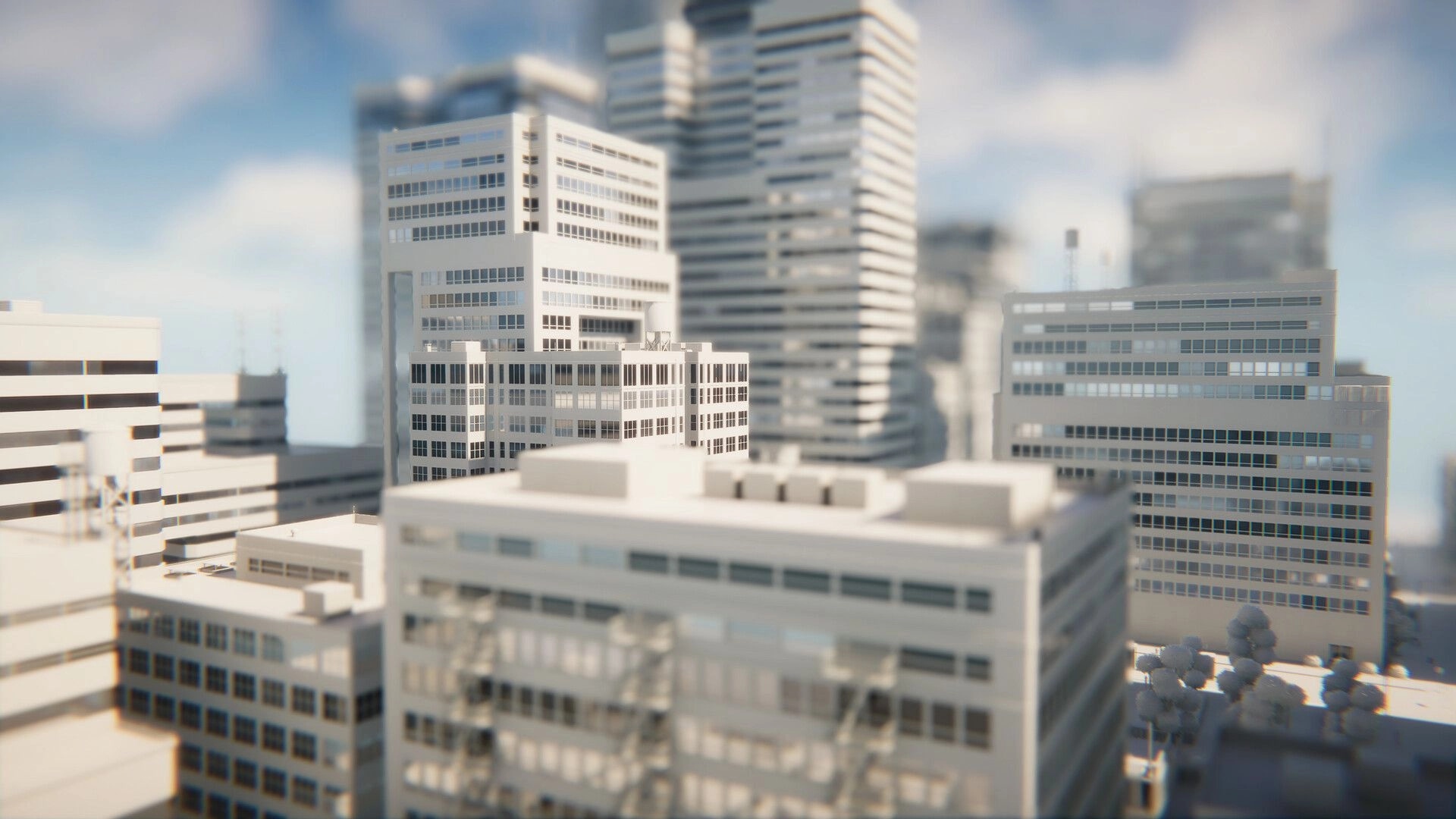 miniopolis: Close-up view of white office blocks and tall towers under a bright, cloudy sky.