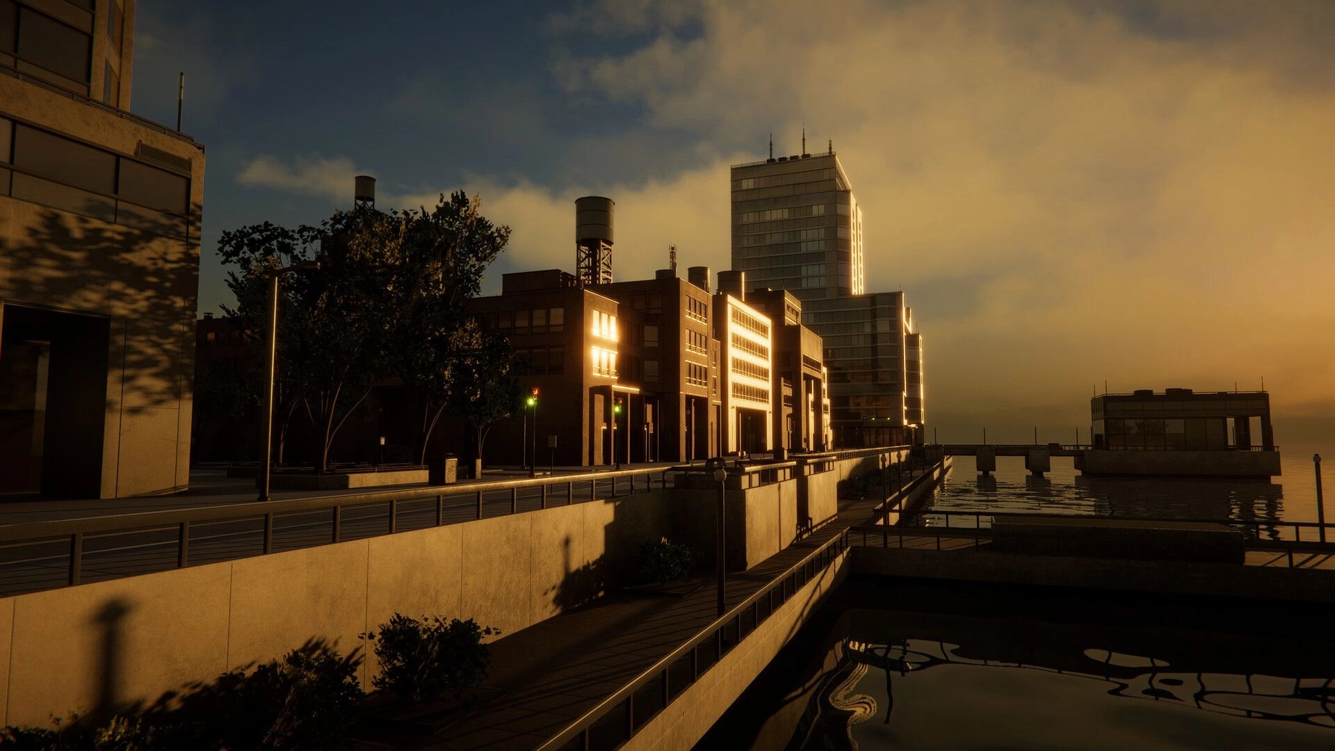 miniopolis: waterfront city blocks with lit windows and water towers at sunset beside a canal walkway.