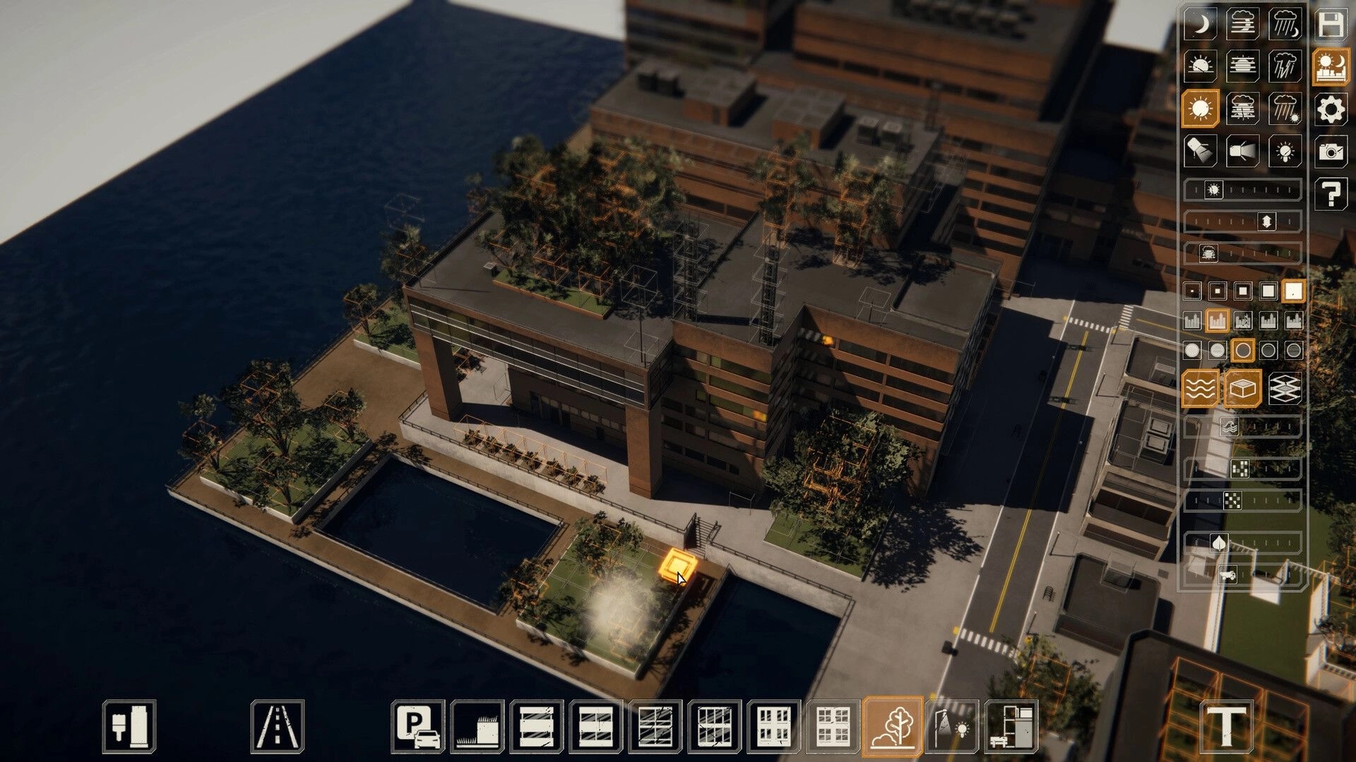 miniopolis: Building editor view with toolbars open over waterfront complex, streets and trees in sunlit city.