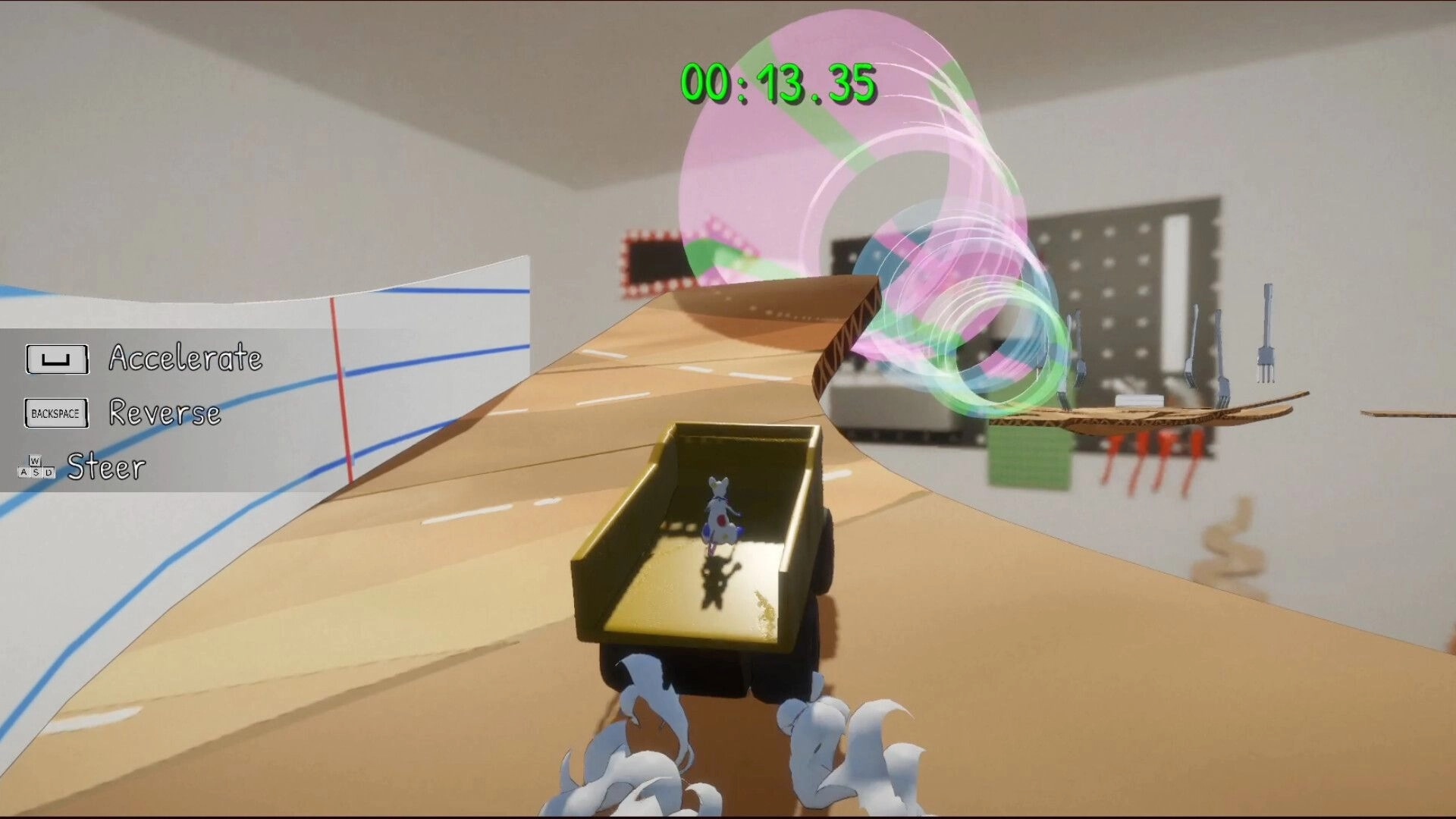 Mischief: Rat driving a toy truck on a cardboard track in a workshop with control instructions visible