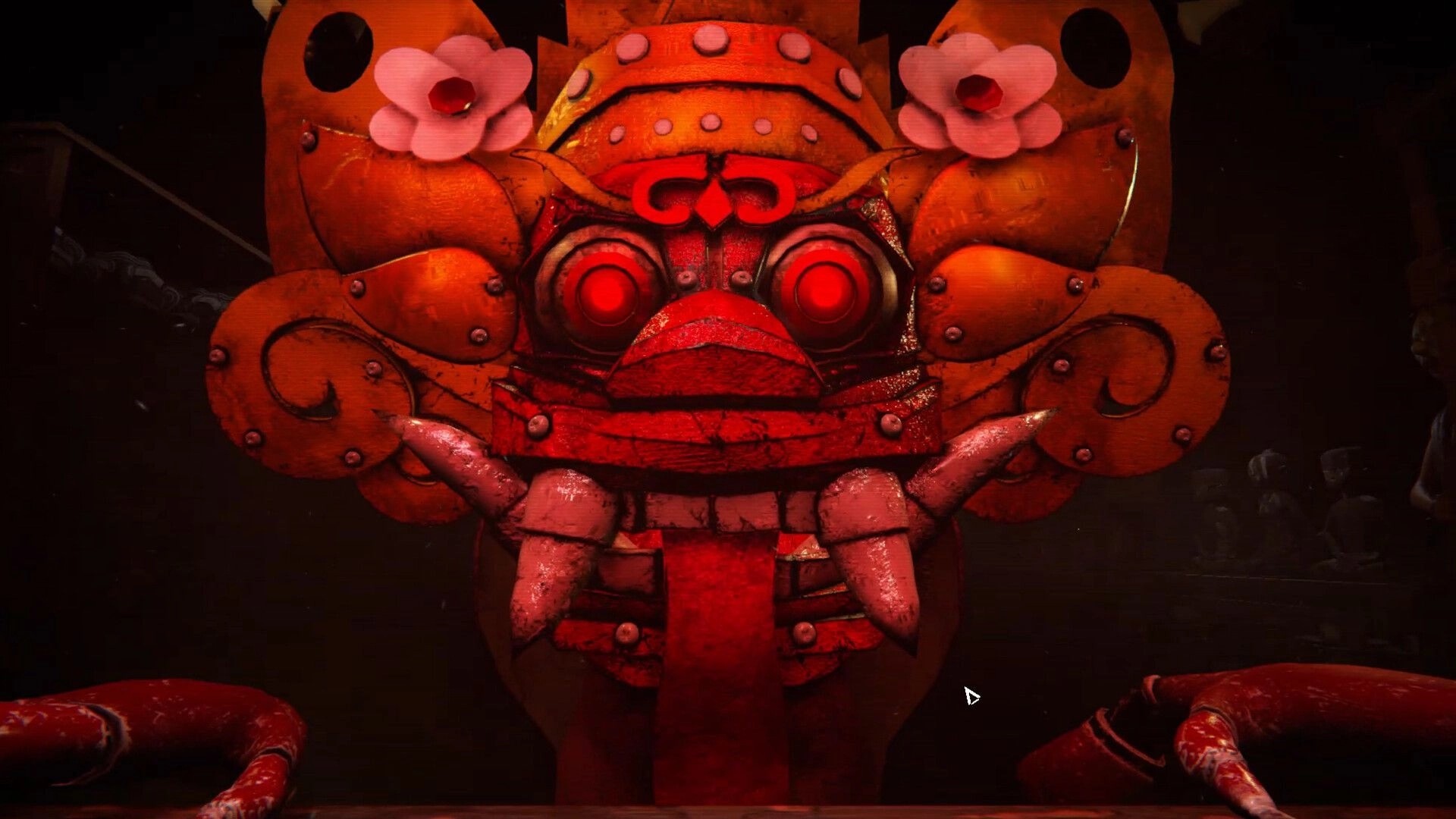 Mission Mancala: Close-up of a red demonic wooden mask with glowing eyes in a dark chamber backdrop.