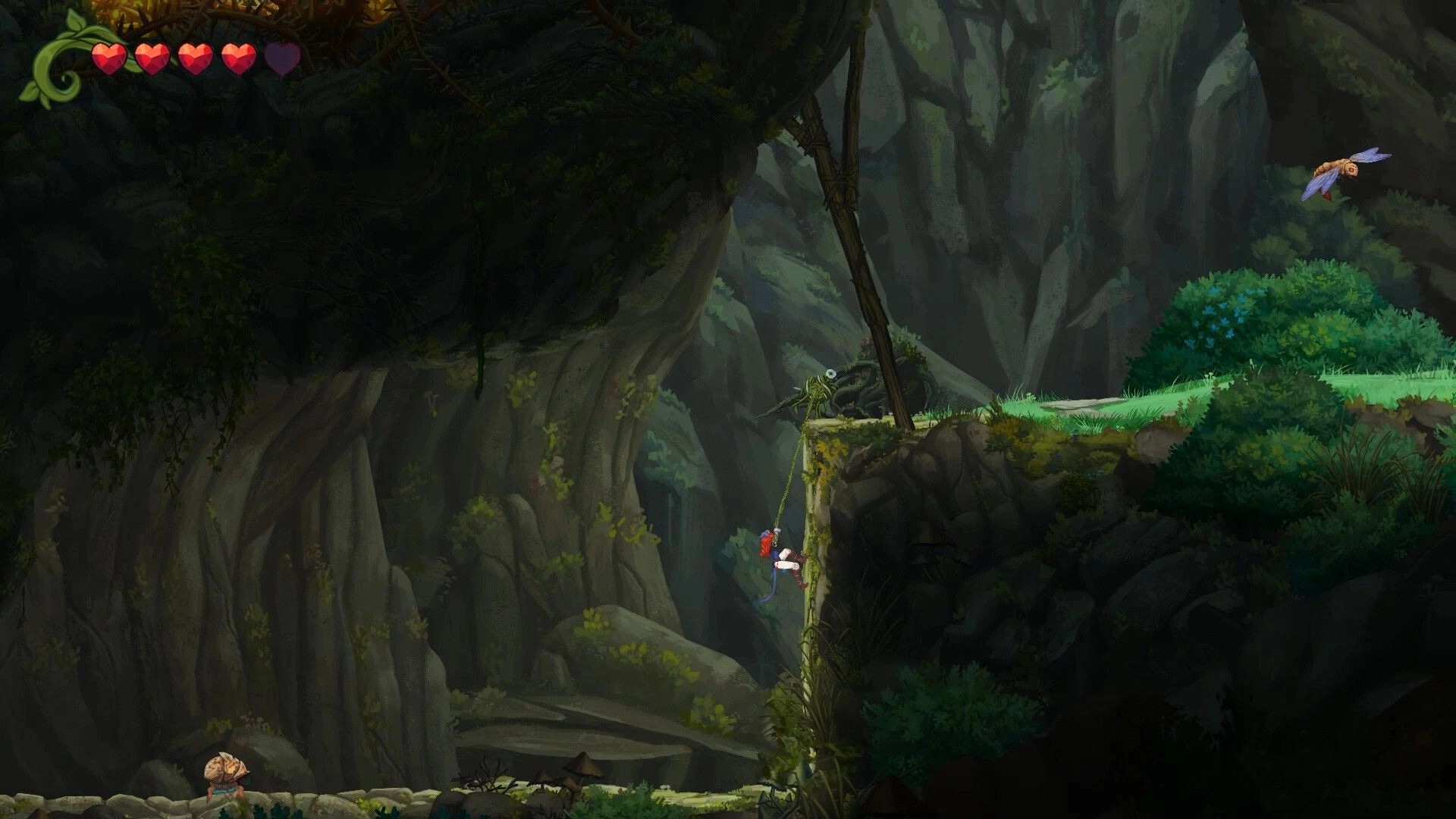 Misspell: Character climbing vine-covered cliffside in lush cavern setting with heart UI displayed