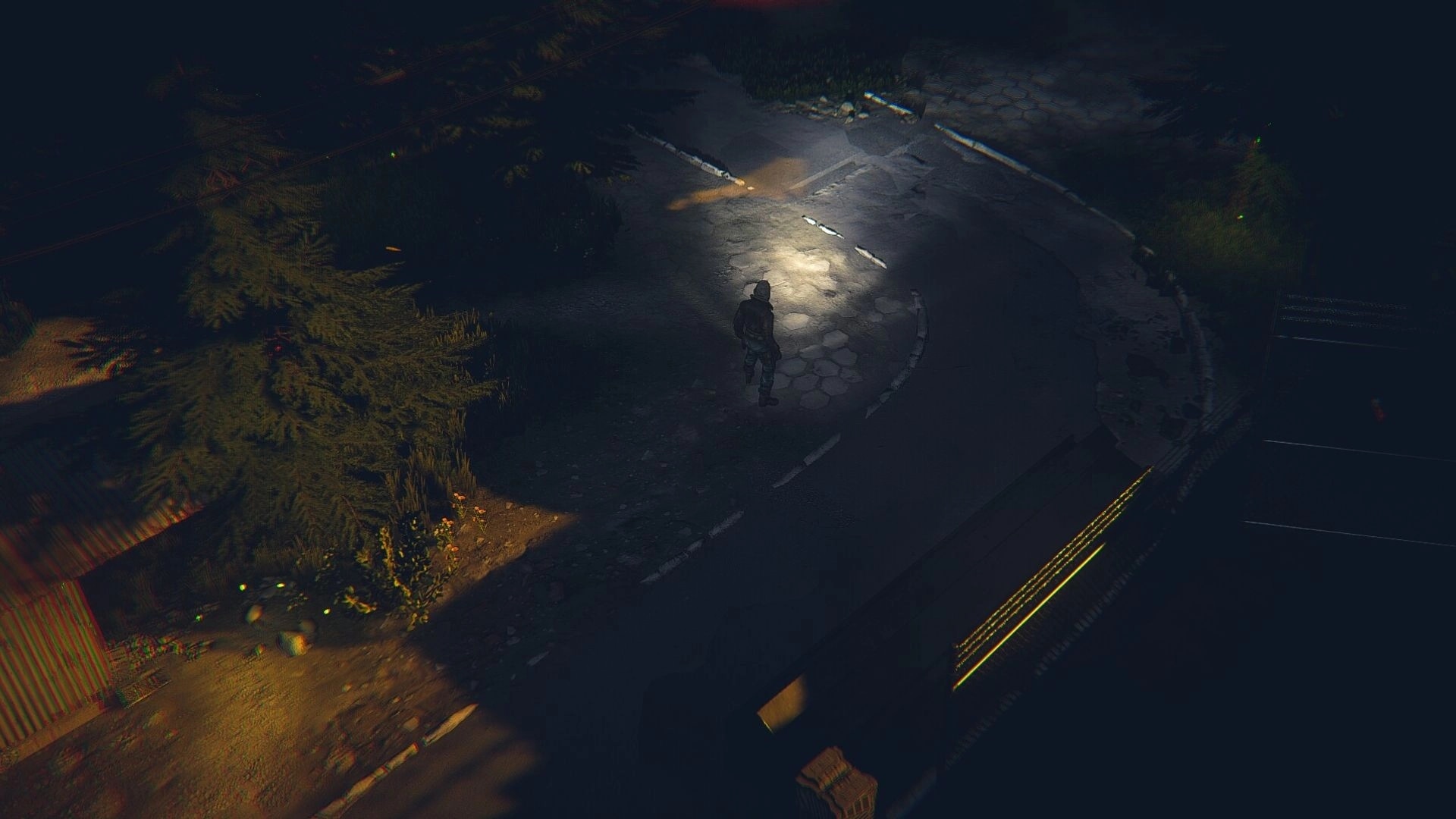 MISTERY: Lone character walks on dimly lit road surrounded by trees at night, creating a tense atmosphere.