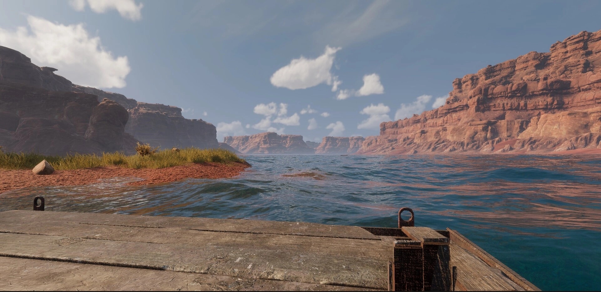 MLF: View from a wooden dock over rippling river water with red canyon cliffs under blue sky.