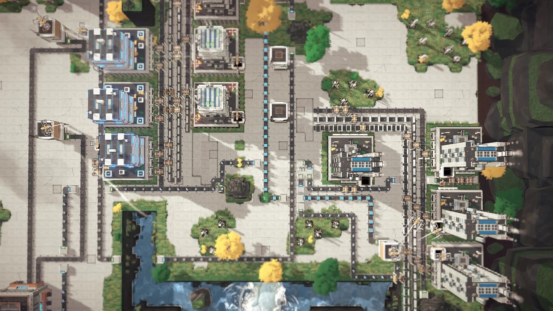 Modulus: Overhead view of complex factory layout with conveyor belts and machinery in a green landscape