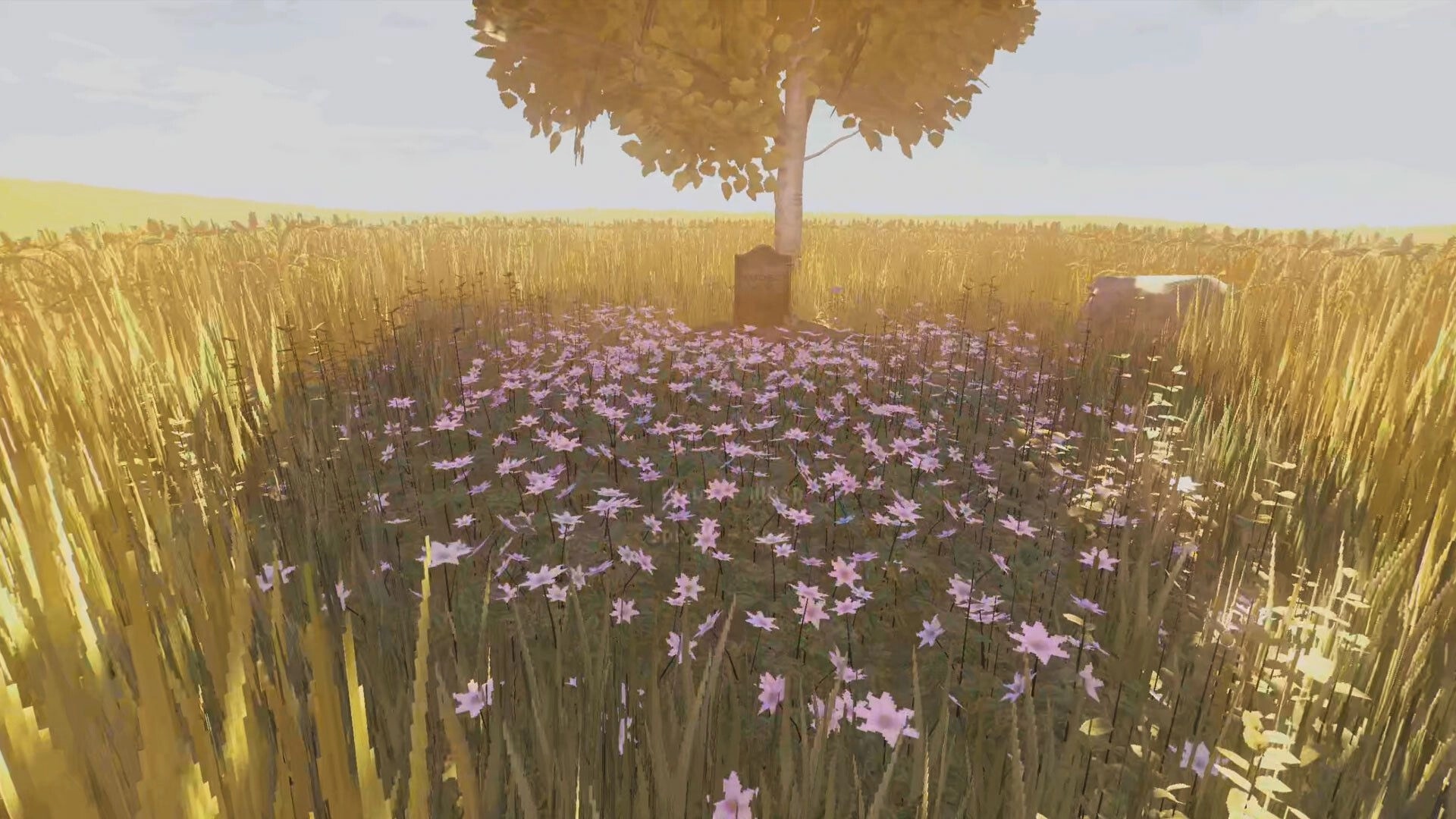 MOLE: Tranquil field with pink flowers, a tree, and gravestone under bright sunlight in a golden wheat field.