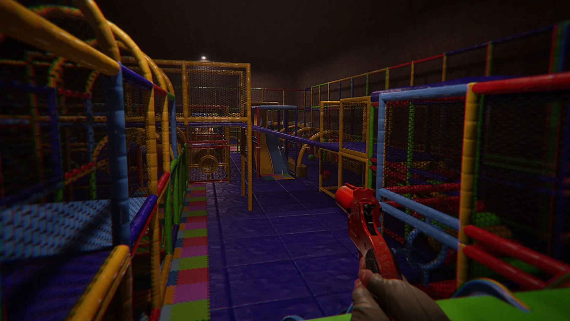 Monterey Jack: Player navigates colorful indoor playground with toy gun, aiming towards netted structures.