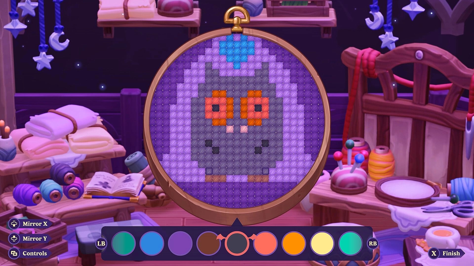 Moonlight Peaks: Cross-stitch pattern editor with color palette and mirror controls in cozy craft room.