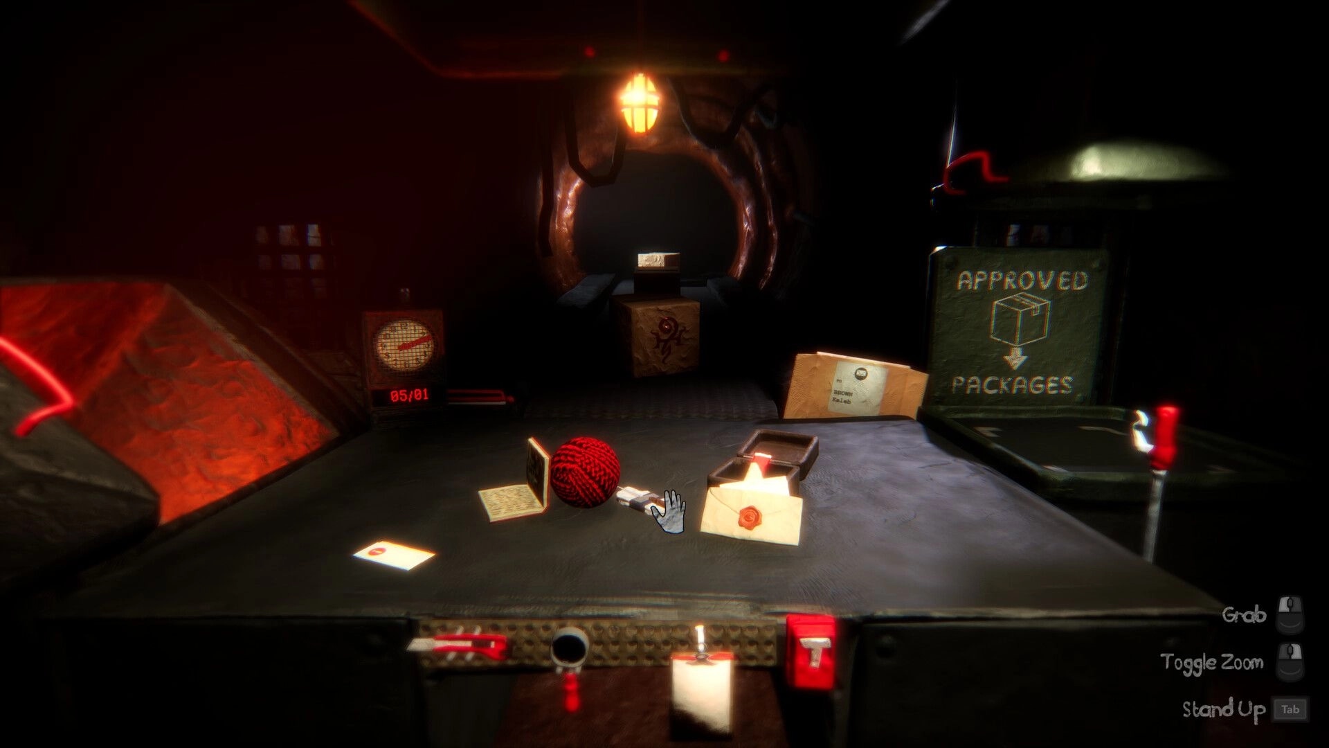Morbid Mailroom: Sorting letters and a red yarn ball on desk in dim tunnel mailroom with Approved bin.