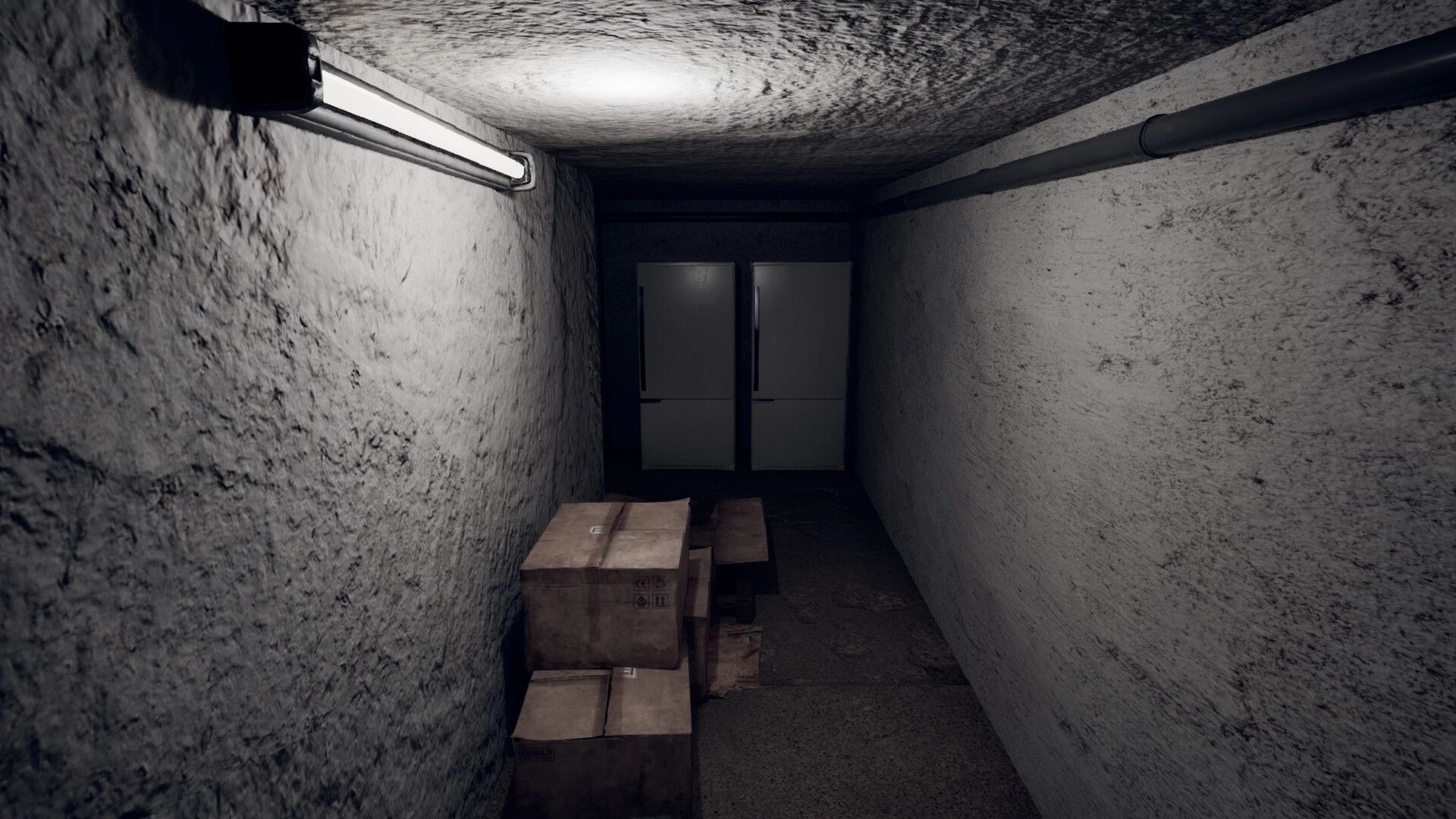 Nachtschicht: Dimly lit narrow corridor with stacked cardboard boxes and two closed refrigerators at the end.