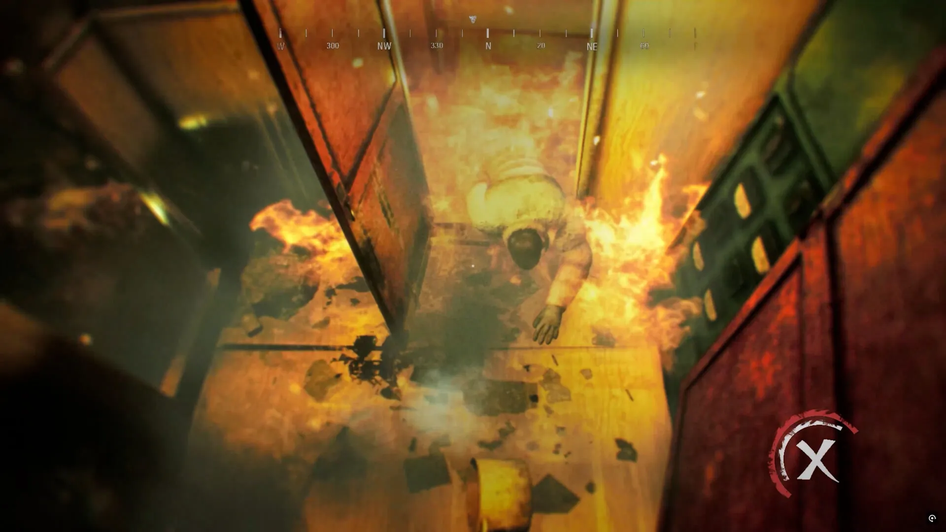 NEDRA: Overhead view of a corridor engulfed in flames with a figure crawling on the floor in distress.