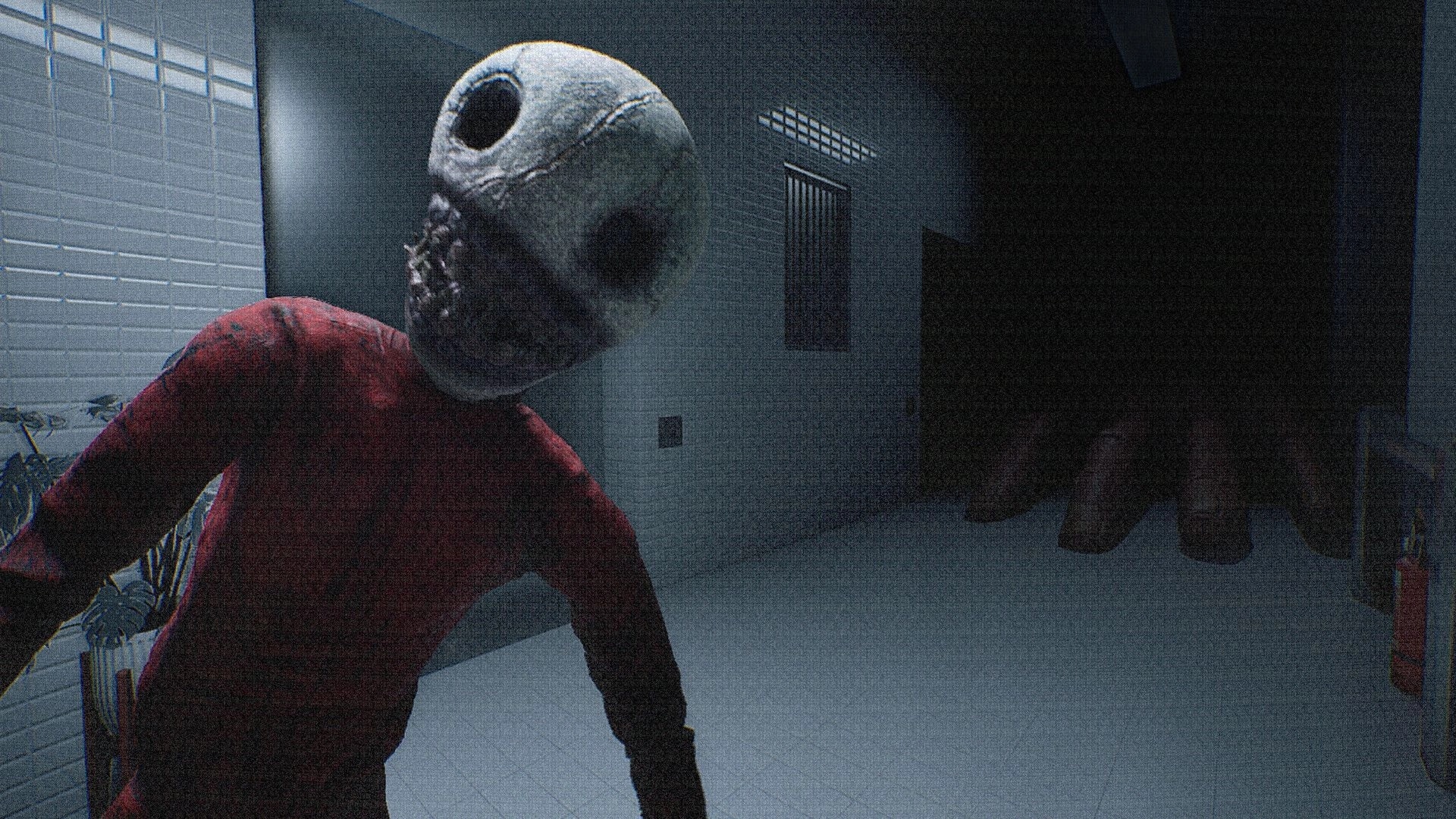 NEVER LOOK BACK: Masked figure in red leans close in a tiled hallway with a dark doorway ahead.
