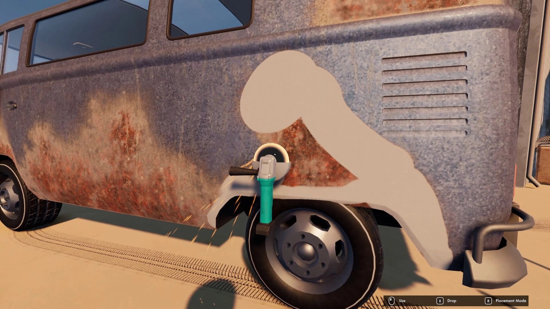 Nomad Drive: Using an angle grinder to remove rust from an RV side panel in a sandy lot UI prompts visible.