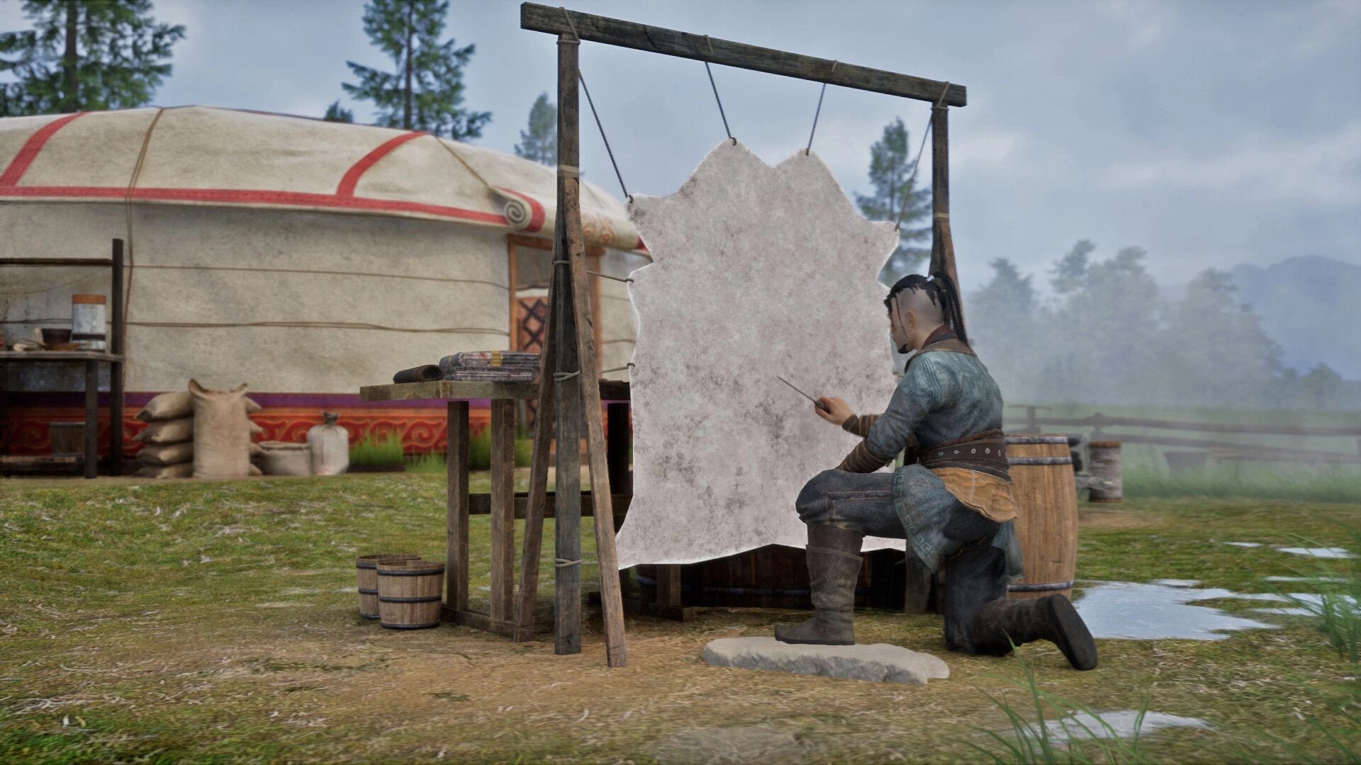 Nomad: Crafter kneels stitching a hanging hide on a wooden frame beside a yurt camp in rain.