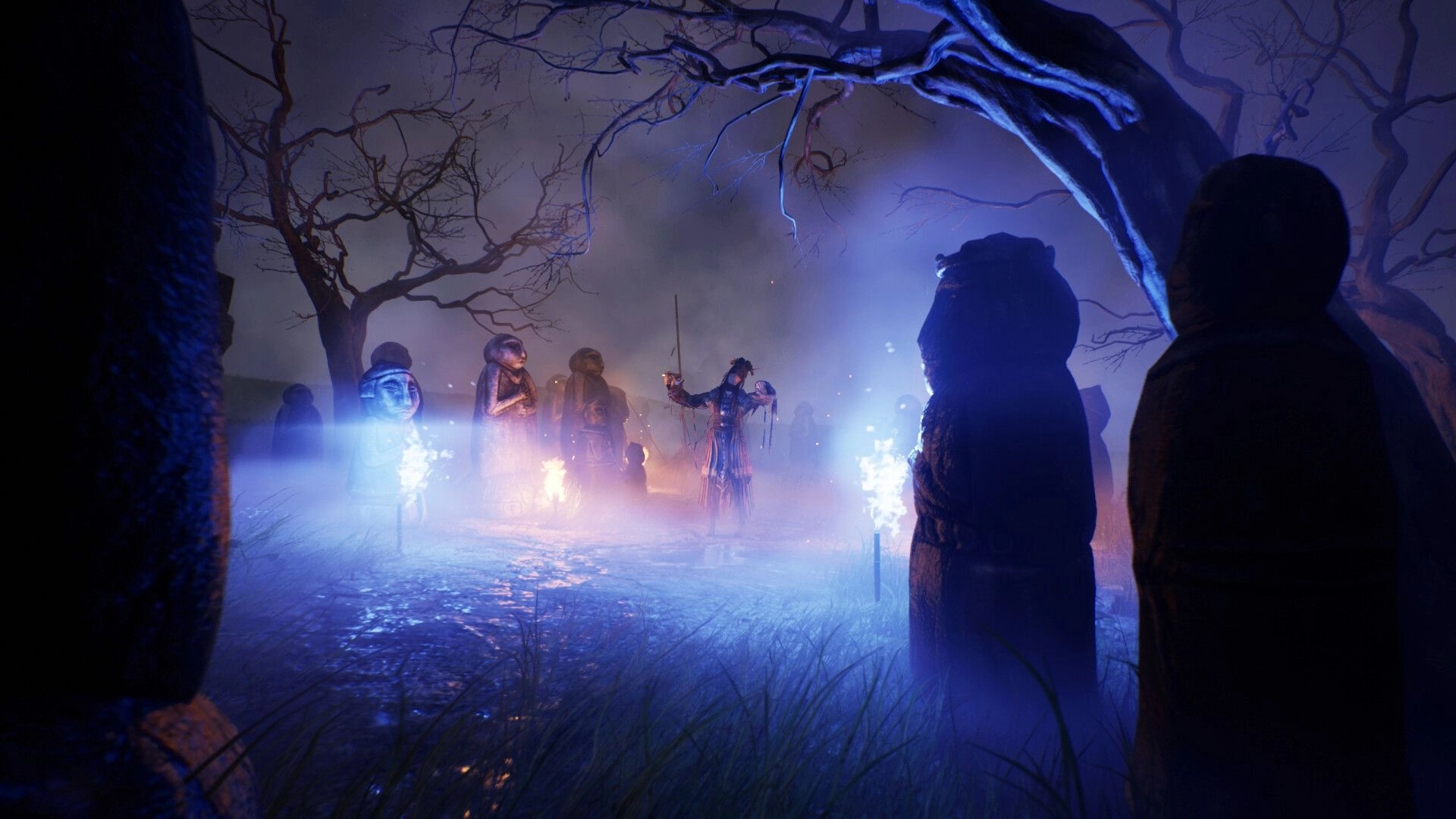 Nomad: Shaman raises a staff among stone idols and blue torches in a foggy night grove.