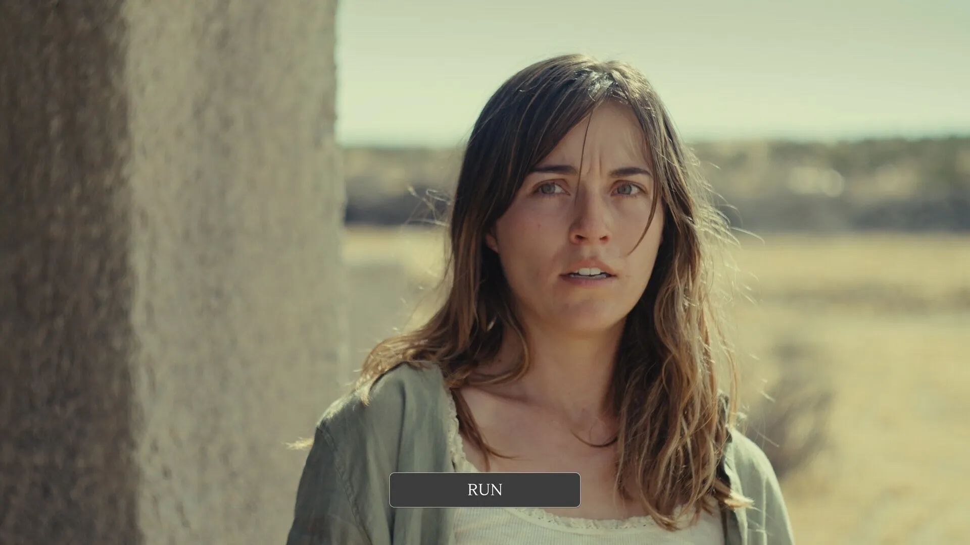 Nowhere to Run: Woman stands outdoors with a "RUN" button prompt in a desert environment.
