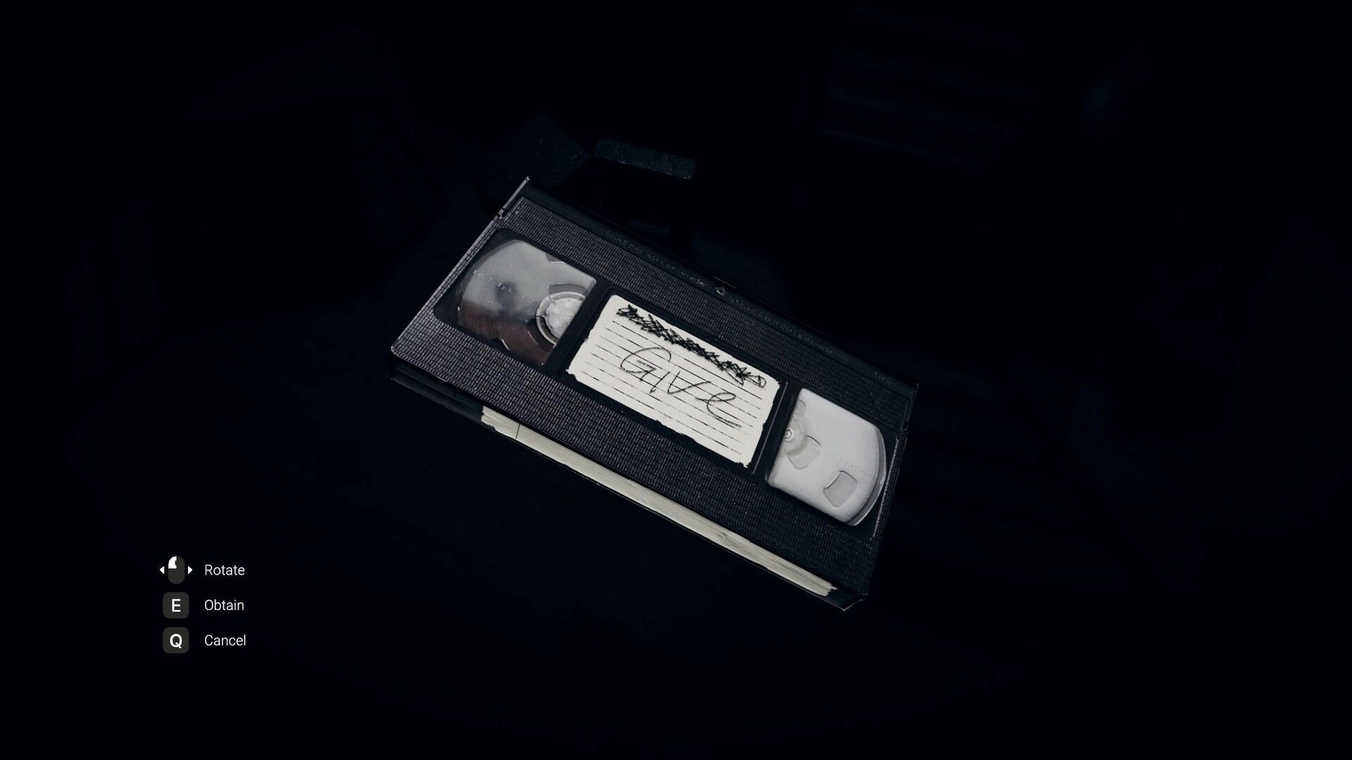 Obfuscation: Player examines a VHS tape labeled "GIVE" in a dark room with rotate, obtain, cancel options.