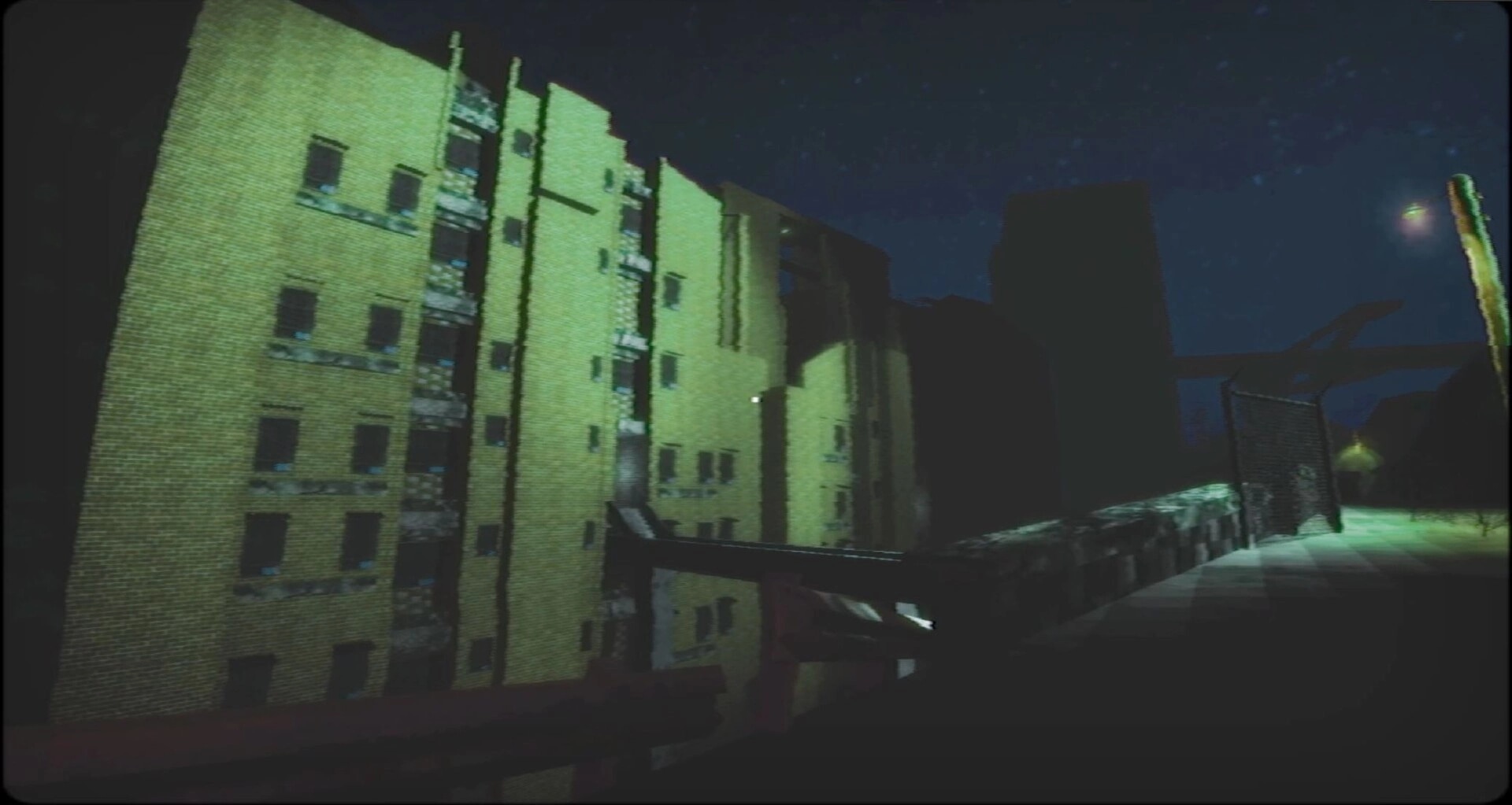 四号对象 Object 4: First-person view of an apartment block and fenced walkway at night under streetlights.