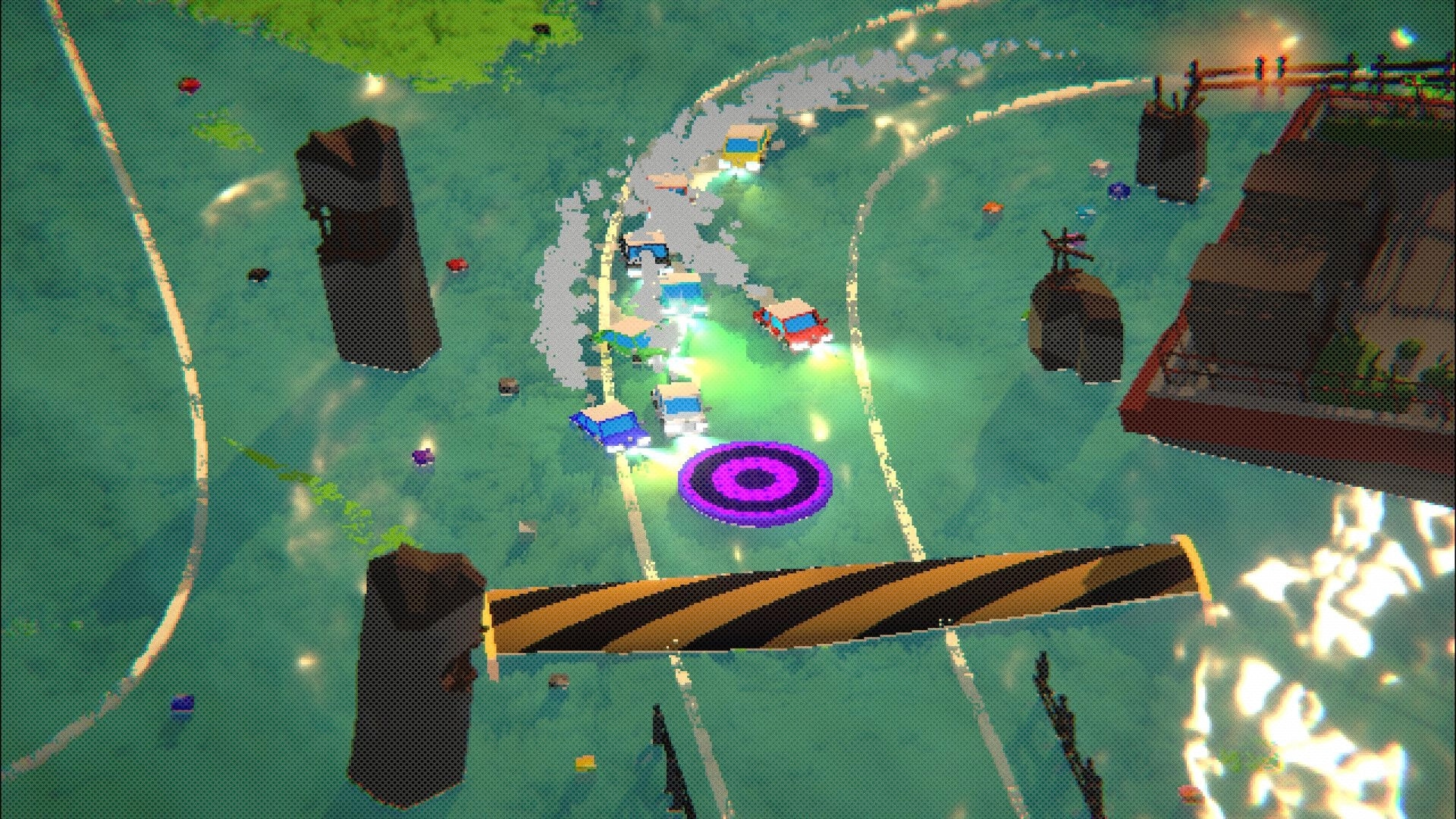 OctaRace: Colorful cars racing around sharp bends on a water-themed track with obstacles and power-ups.