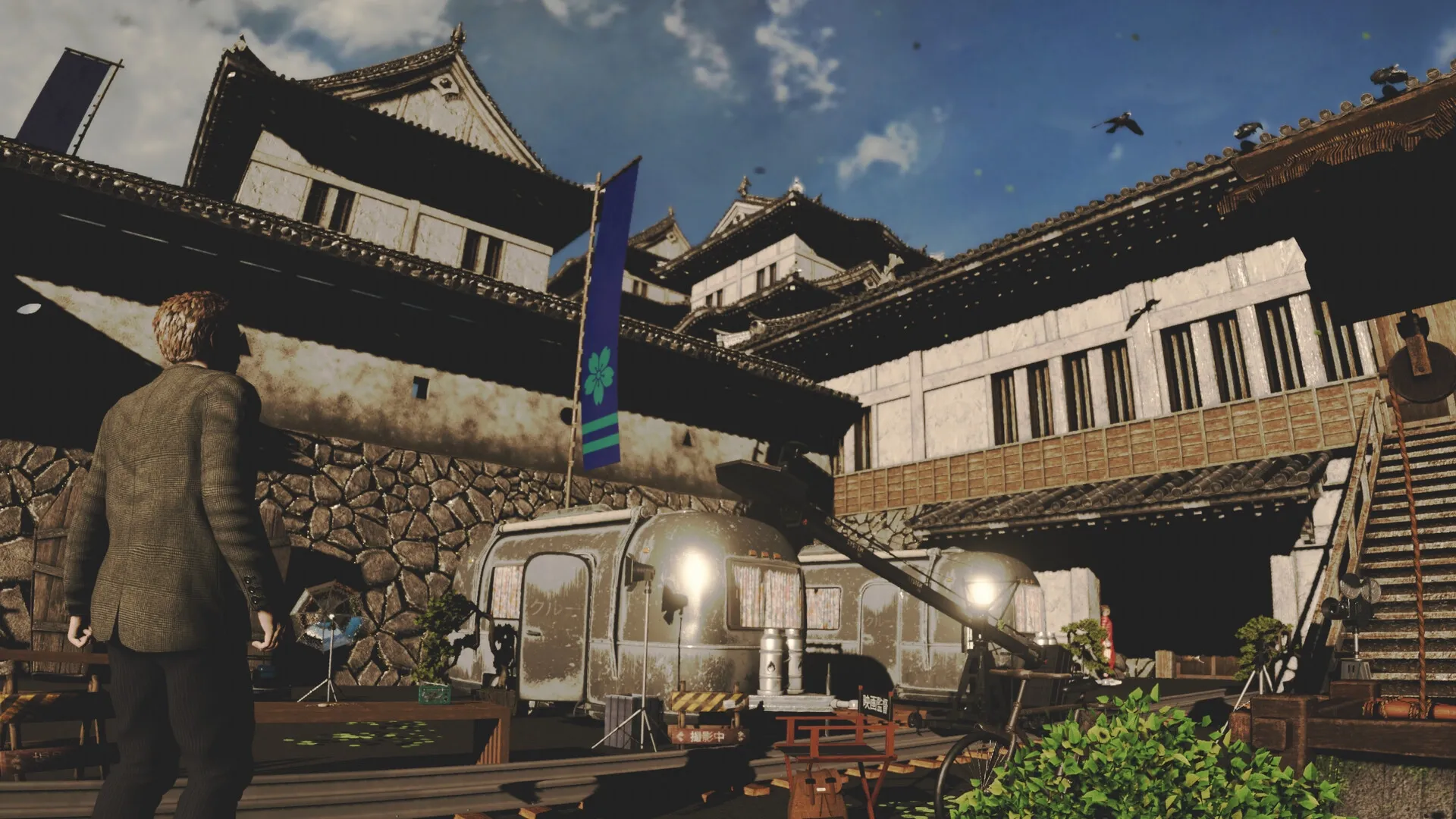 Okinawa Journal: Journalist explores ancient castle courtyard with film set equipment and banners visible