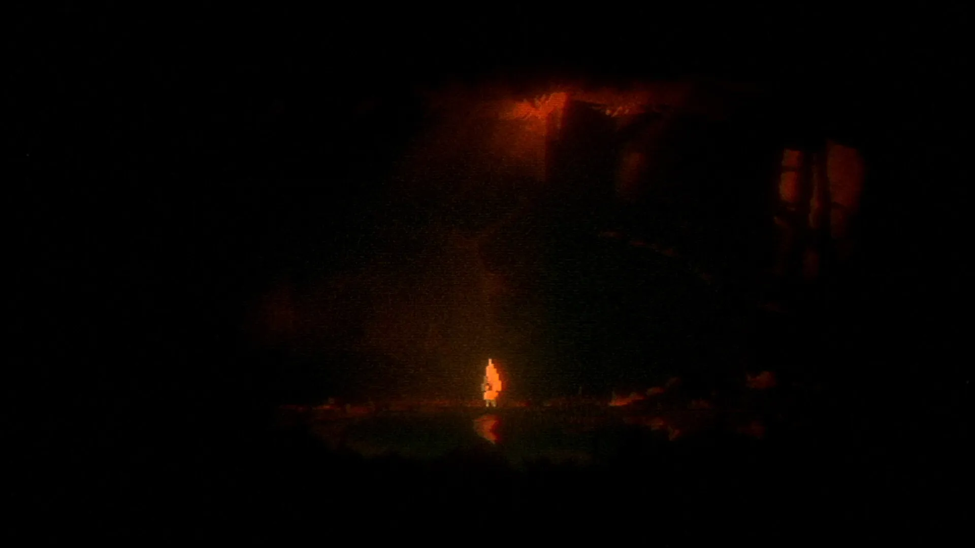 OMUT: Lone character stands illuminated in a dark, eerie cave with red lighting creating a haunting glow.