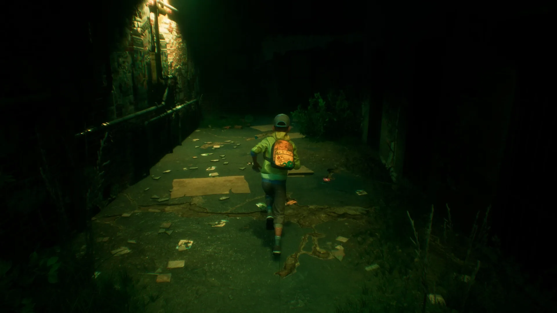 ONE WAY HOME: Boy runs down dark alley with backpack, scattered papers on ground, dim light overhead
