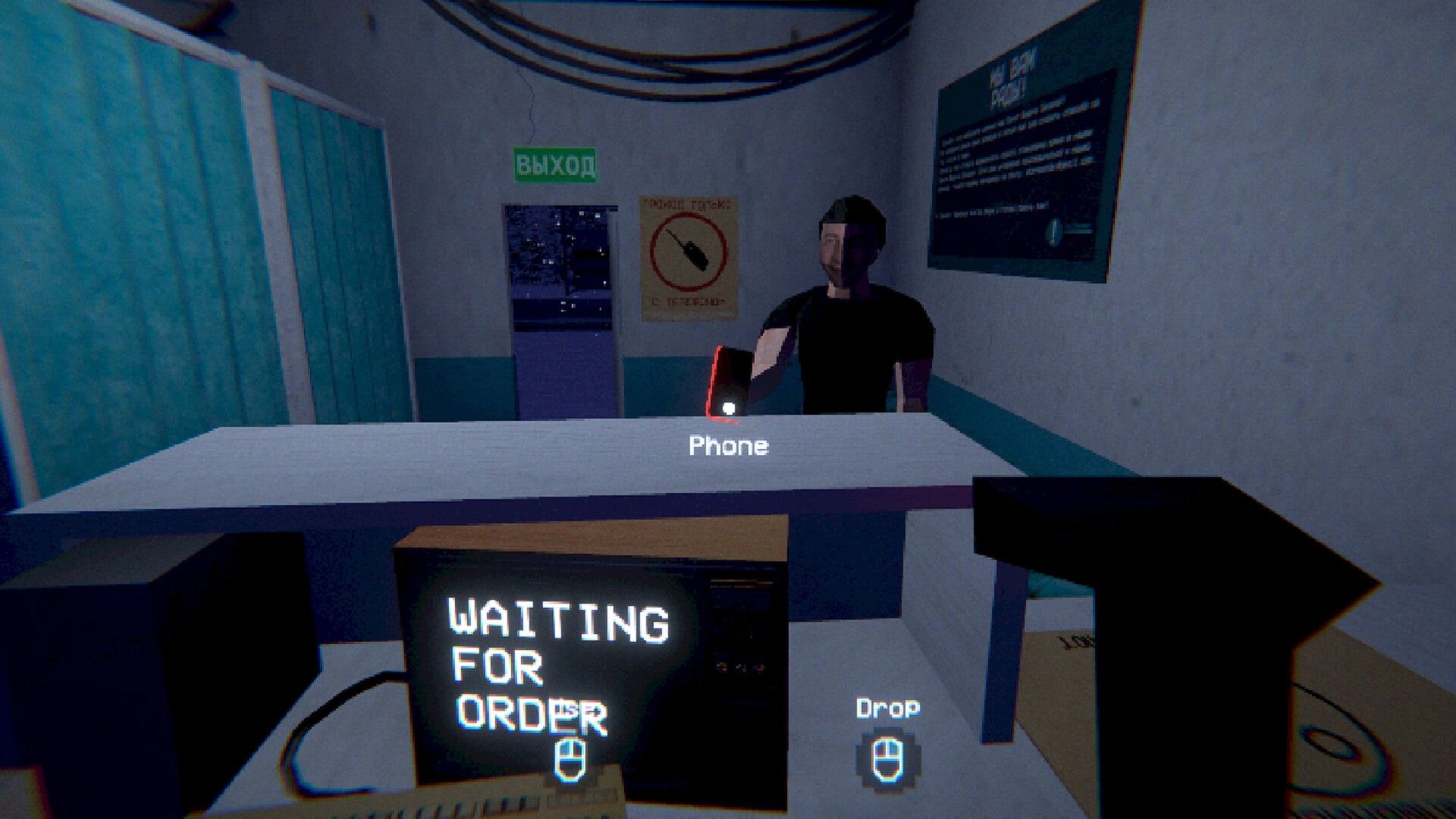 ORDER POINT: Holding a phone at the counter while a customer waits in a small pickup station office.