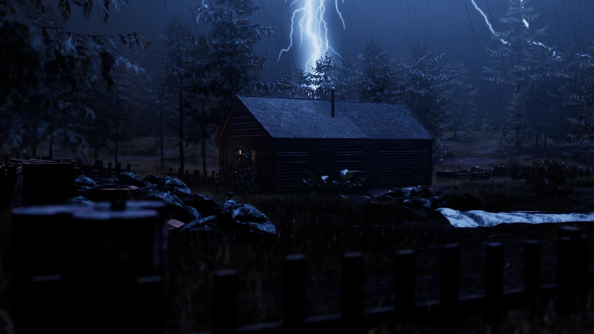 ORMOD: Nighttime view of a wooden cabin as lightning flashes and rain falls in a dark forest clearing.