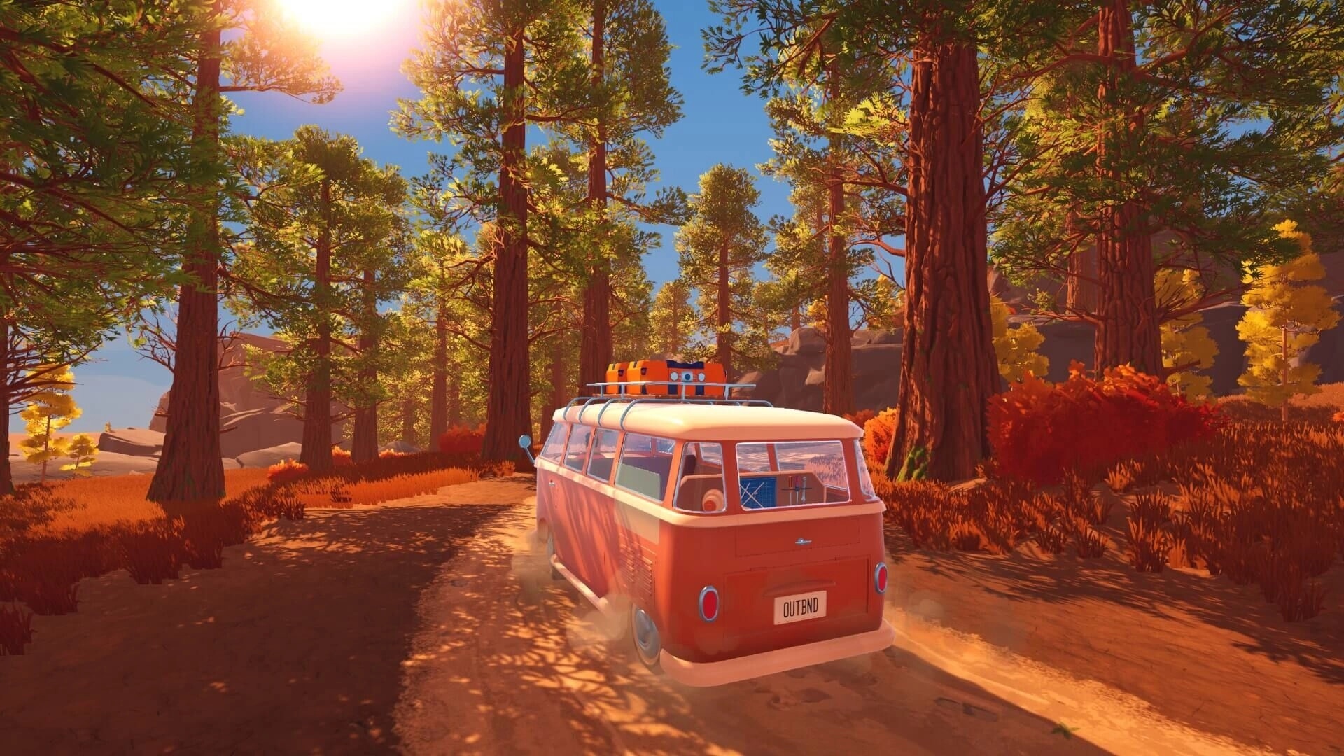 Outbound: Orange camper van driving on a dirt road through sunlit pine forest with red shrubs.