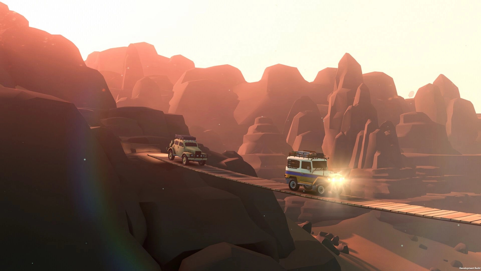 over the hill: two off-road vehicles cross a narrow wooden bridge in a sunlit canyon at dusk.