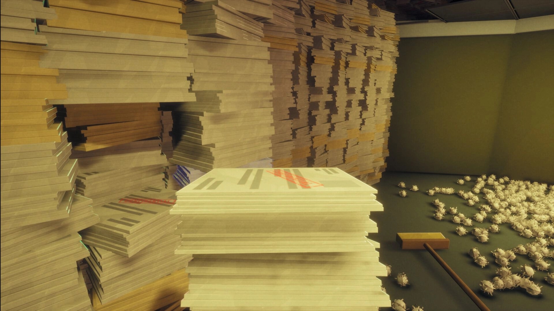 Paper Shredder: Towering stacks of paper and crumpled scraps beside a broom in a storage room.