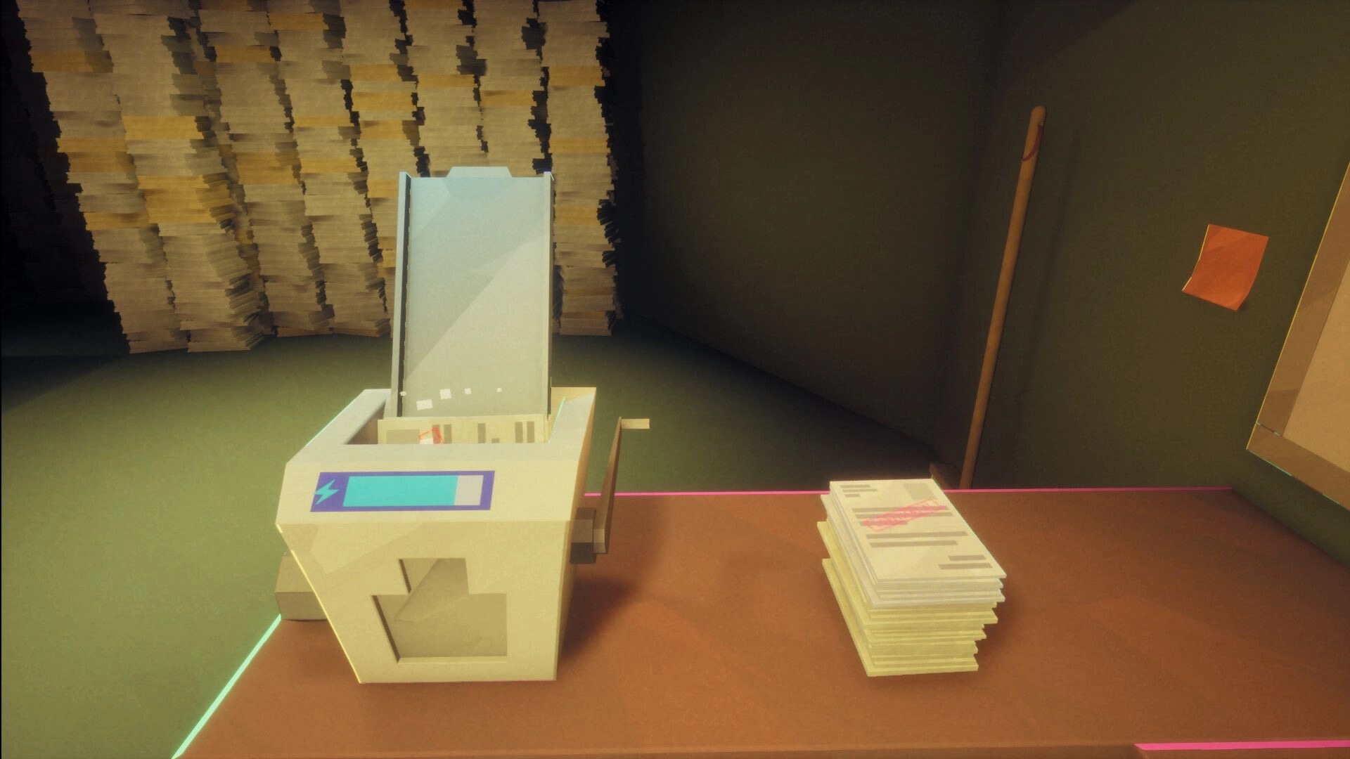 Paper Shredder: Desktop shredder with power meter beside paper stack in cluttered office corner.