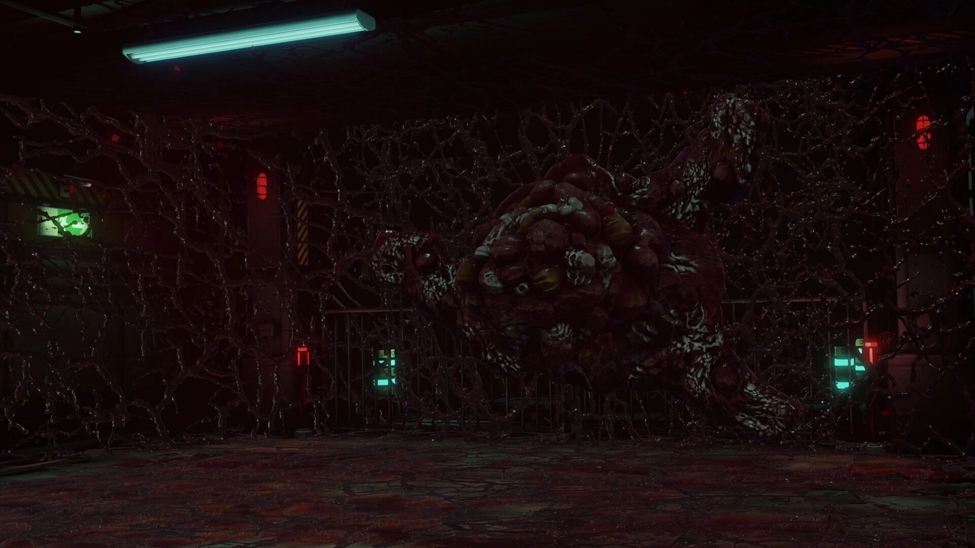 Parasite Mutant: Large organic mass in dimly lit, tangled corridor with glowing red and green lights