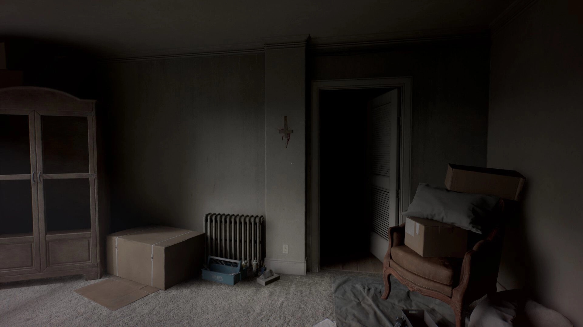 Perceptum: First-person view of a dim room with boxes, wardrobe, and open doorway into darkness.
