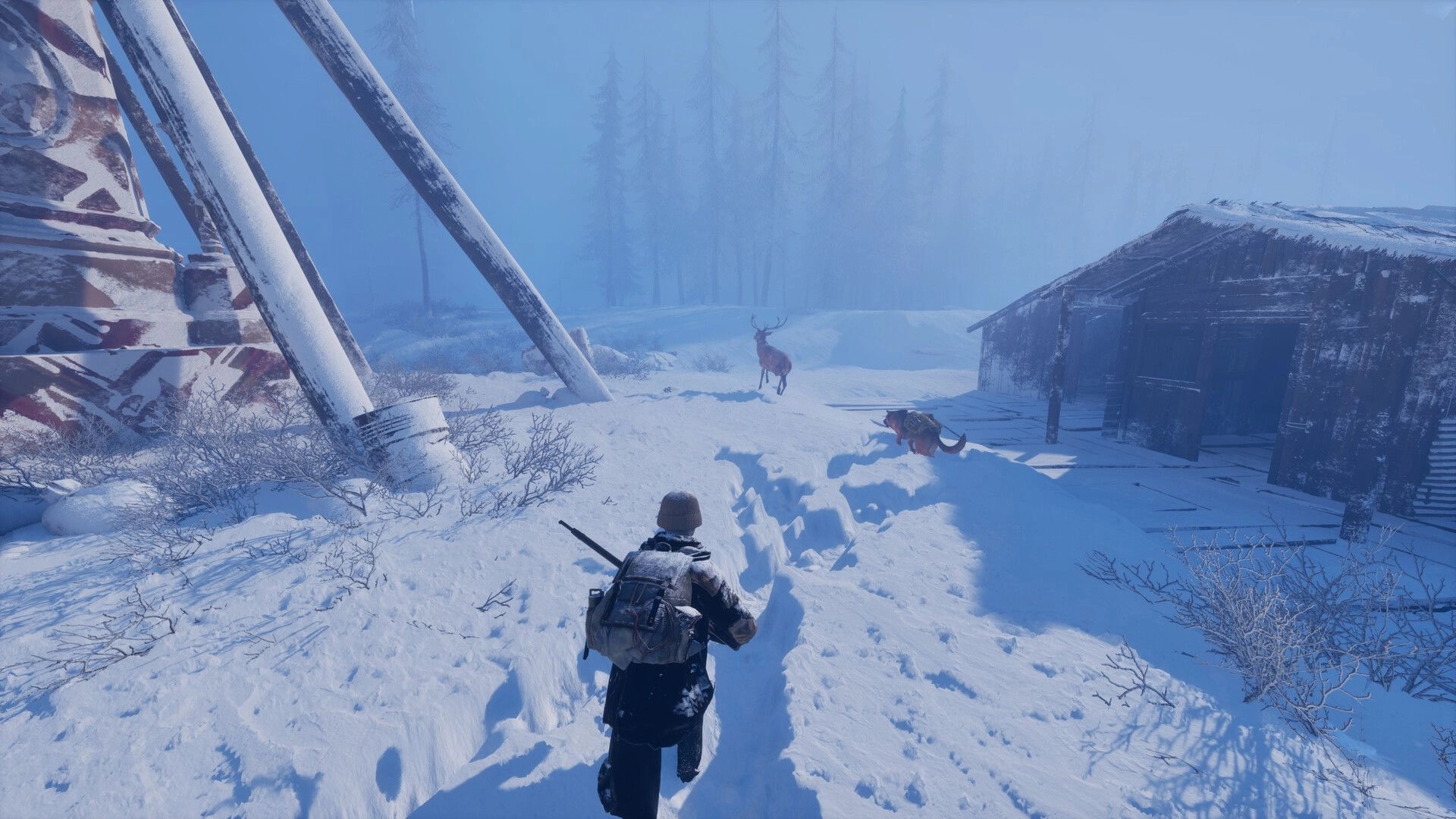Permafrost: Player approaches a deer near a snow-covered cabin and tower in a frozen wilderness.