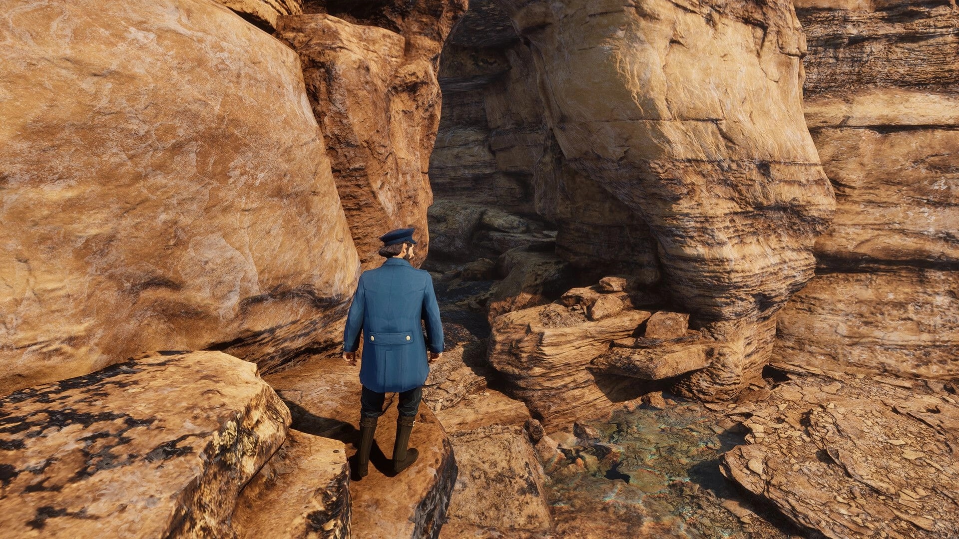 Pharos Light: Third-person sailor in blue coat explores a narrow rocky canyon with shallow water pool.