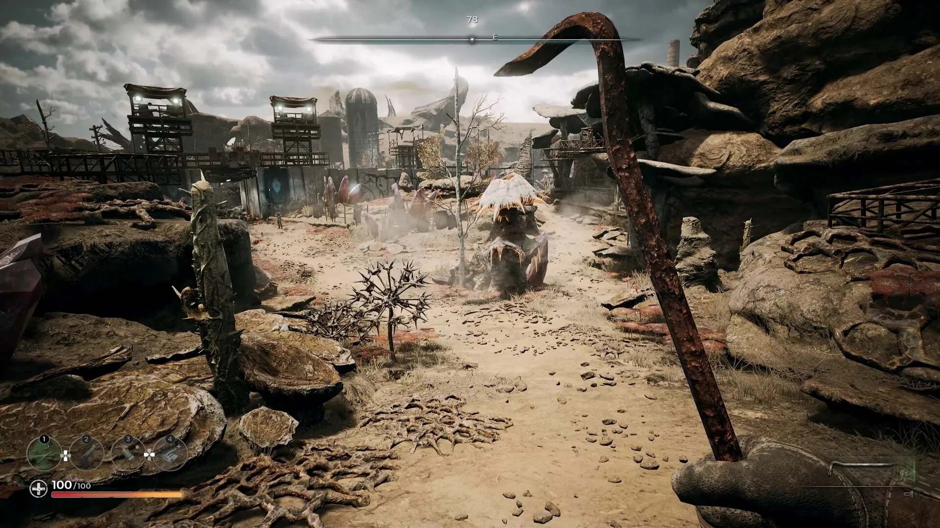 PIONER: First-person view holding a crowbar in a desolate wasteland with rocky terrain and structures.