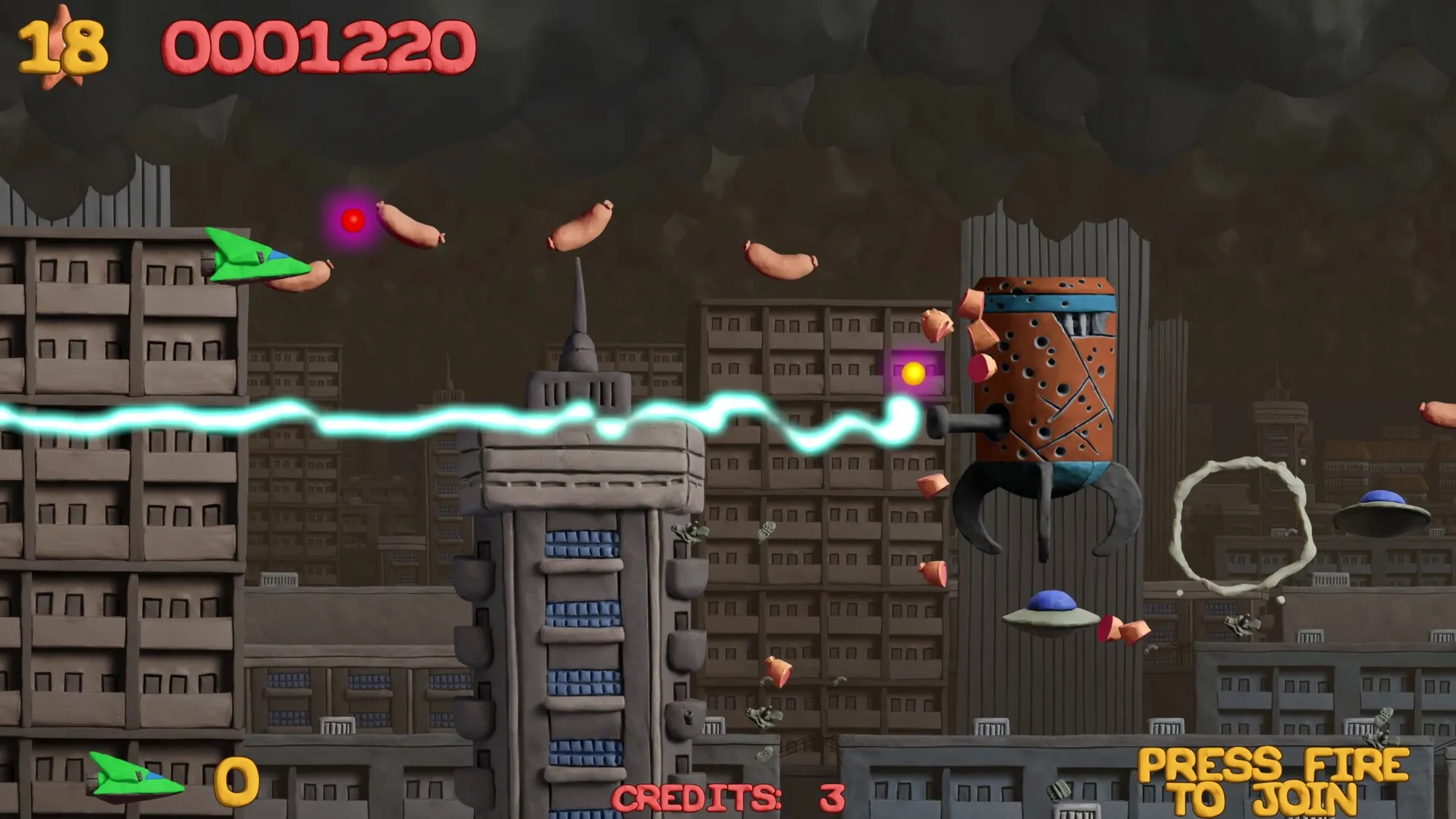 Platypus Reclayed: Green ship dodging sausages with laser in clay cityscape, score and credits visible.
