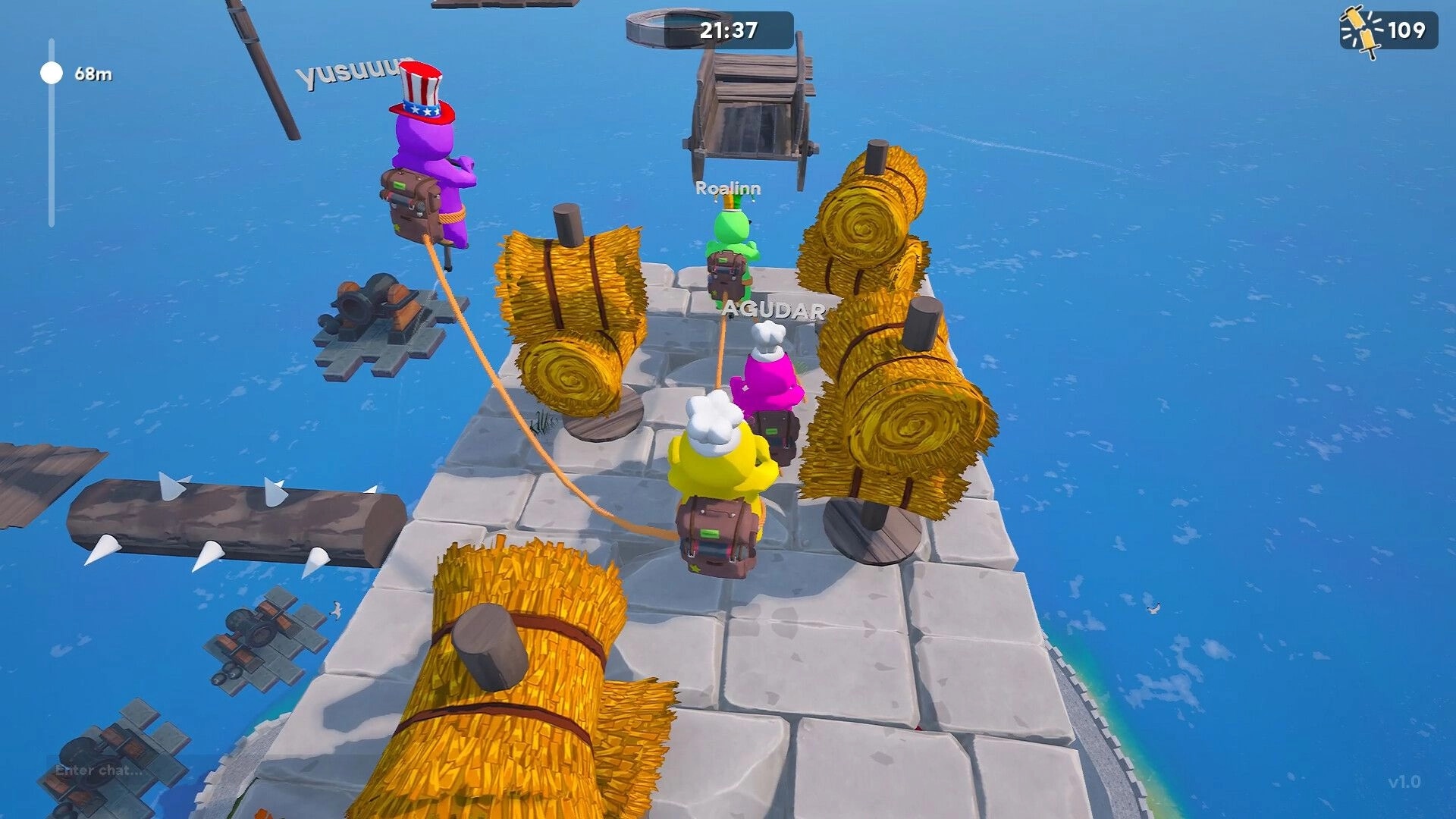 Pogo With Friends: Four pogo players dodge hay bales on a stone platform above the ocean with timer UI.