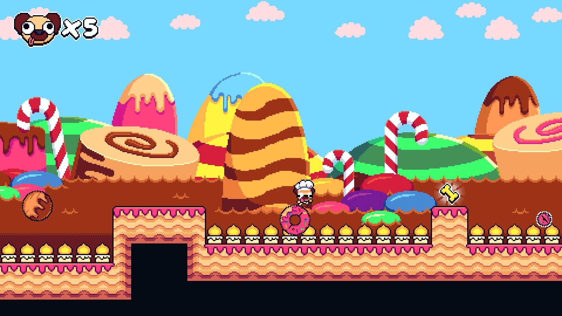 Pogui: Pogui runs through a candy-themed platform level with a life counter in the corner.